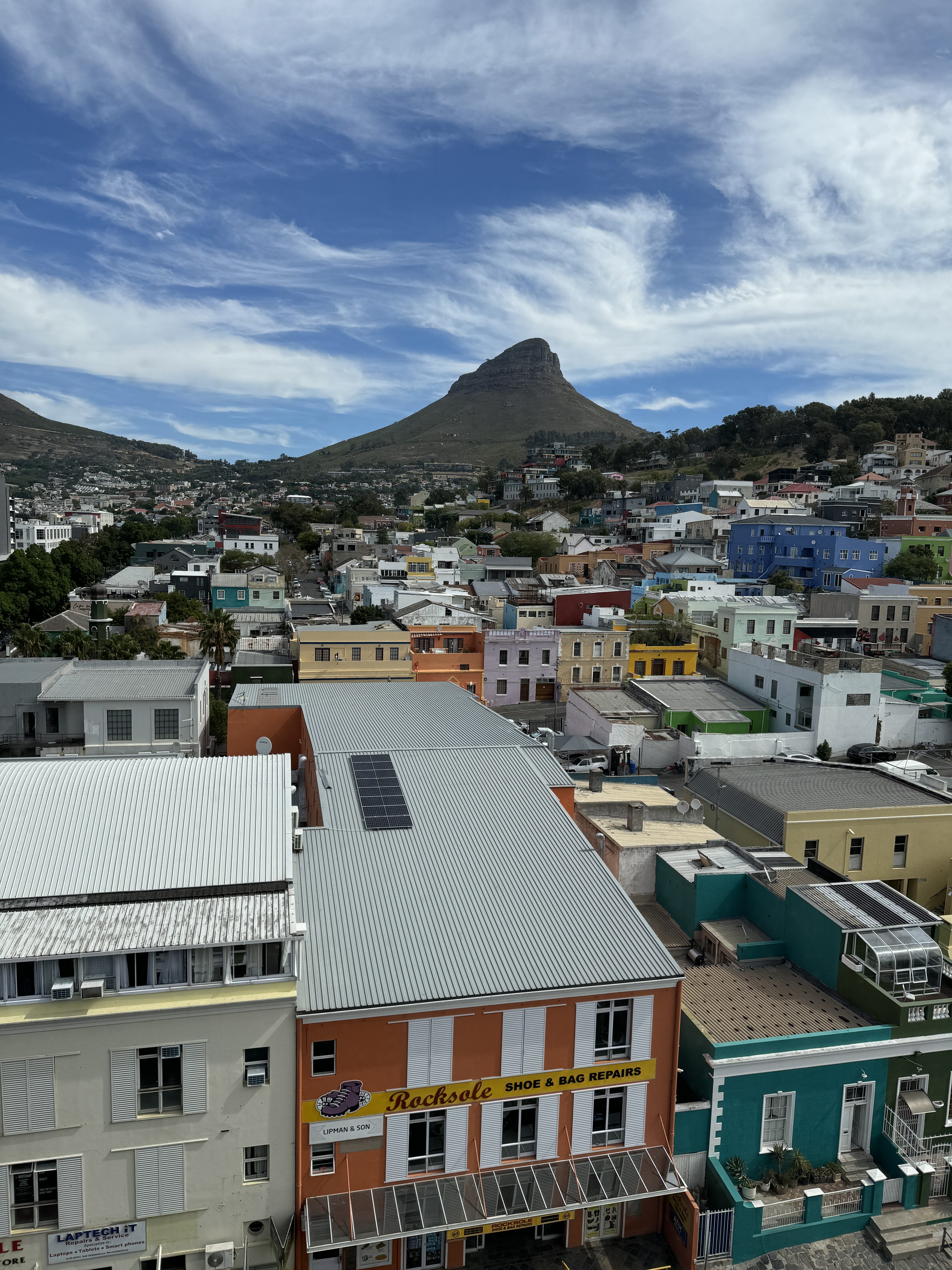 IMG 0110 The view from our room showcasing Table Mountain, Lion's Head, and the Bo-Kaap neighborhood.