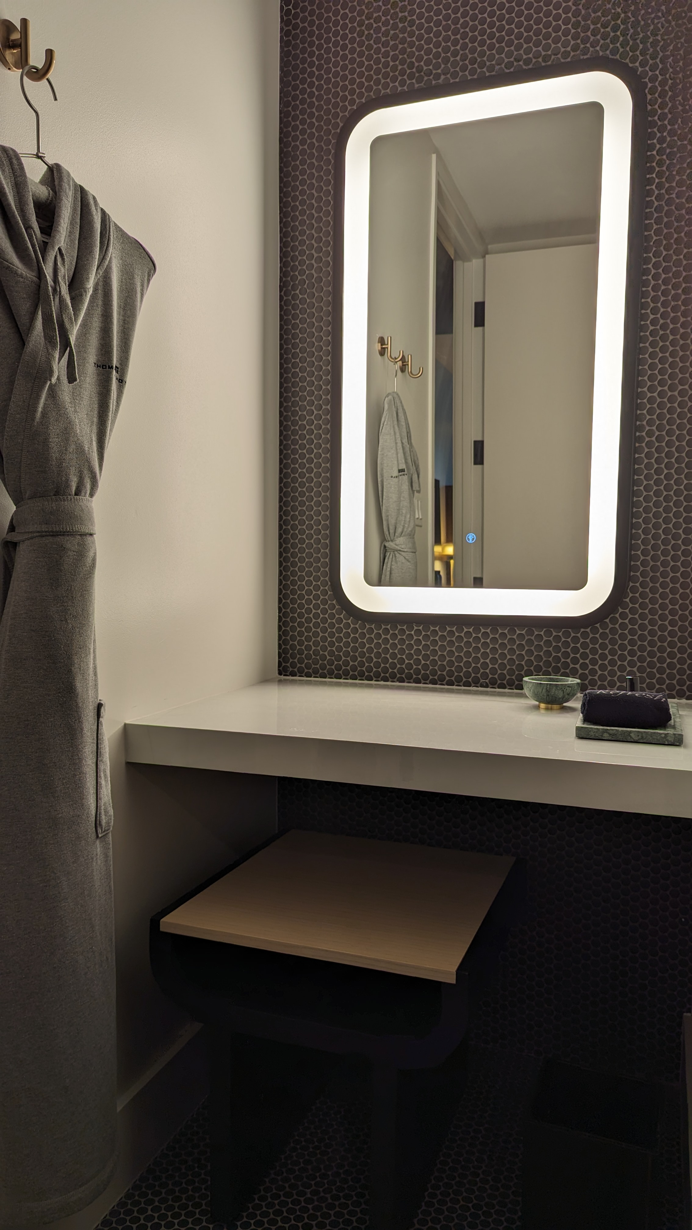 Thompson Houston guestroom bathroom mirror and robe Thompson Houston guestroom bathroom mirror and robe