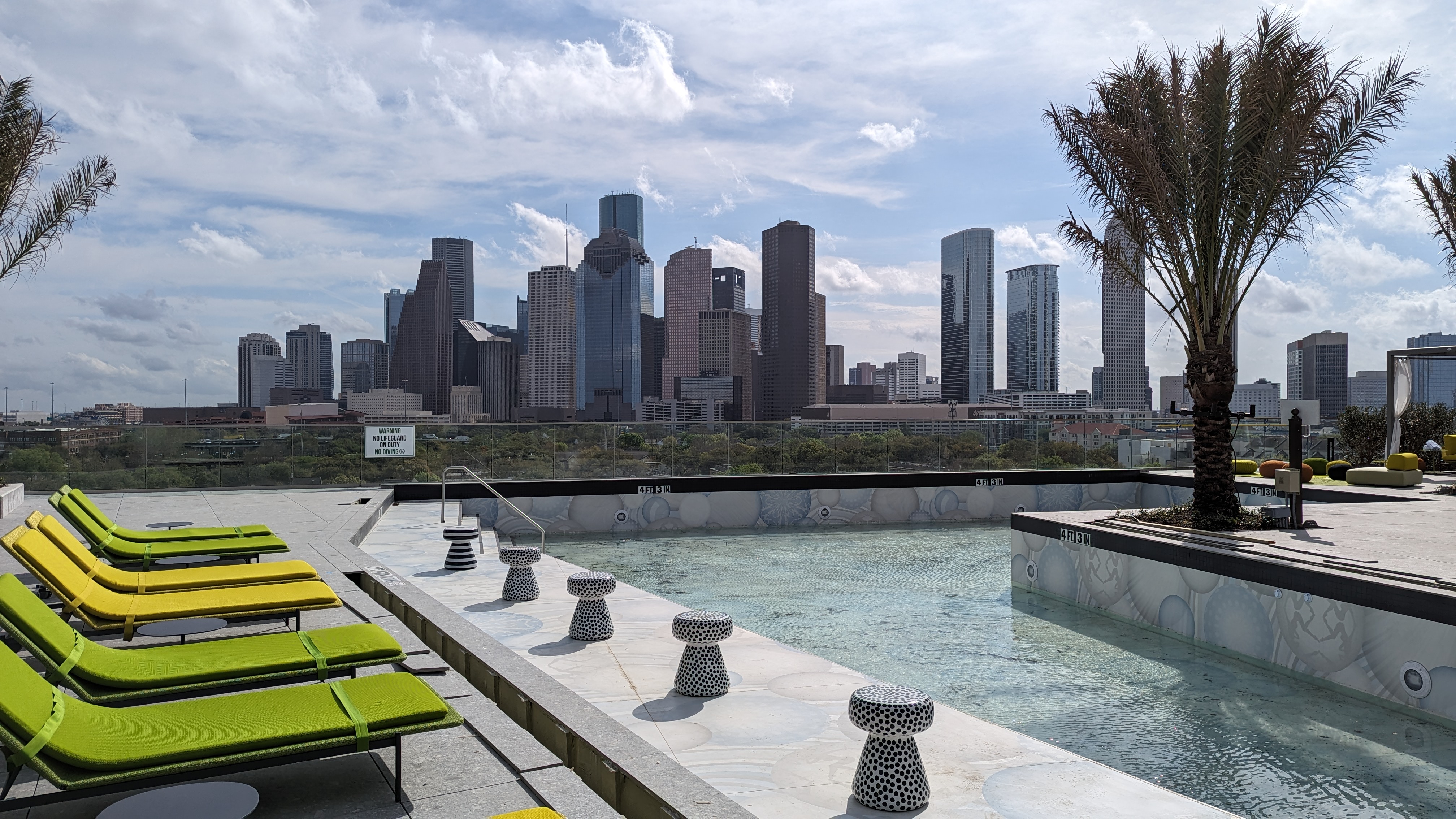 Thompson Houston pool skyline and loungers Thompson Houston pool skyline and loungers