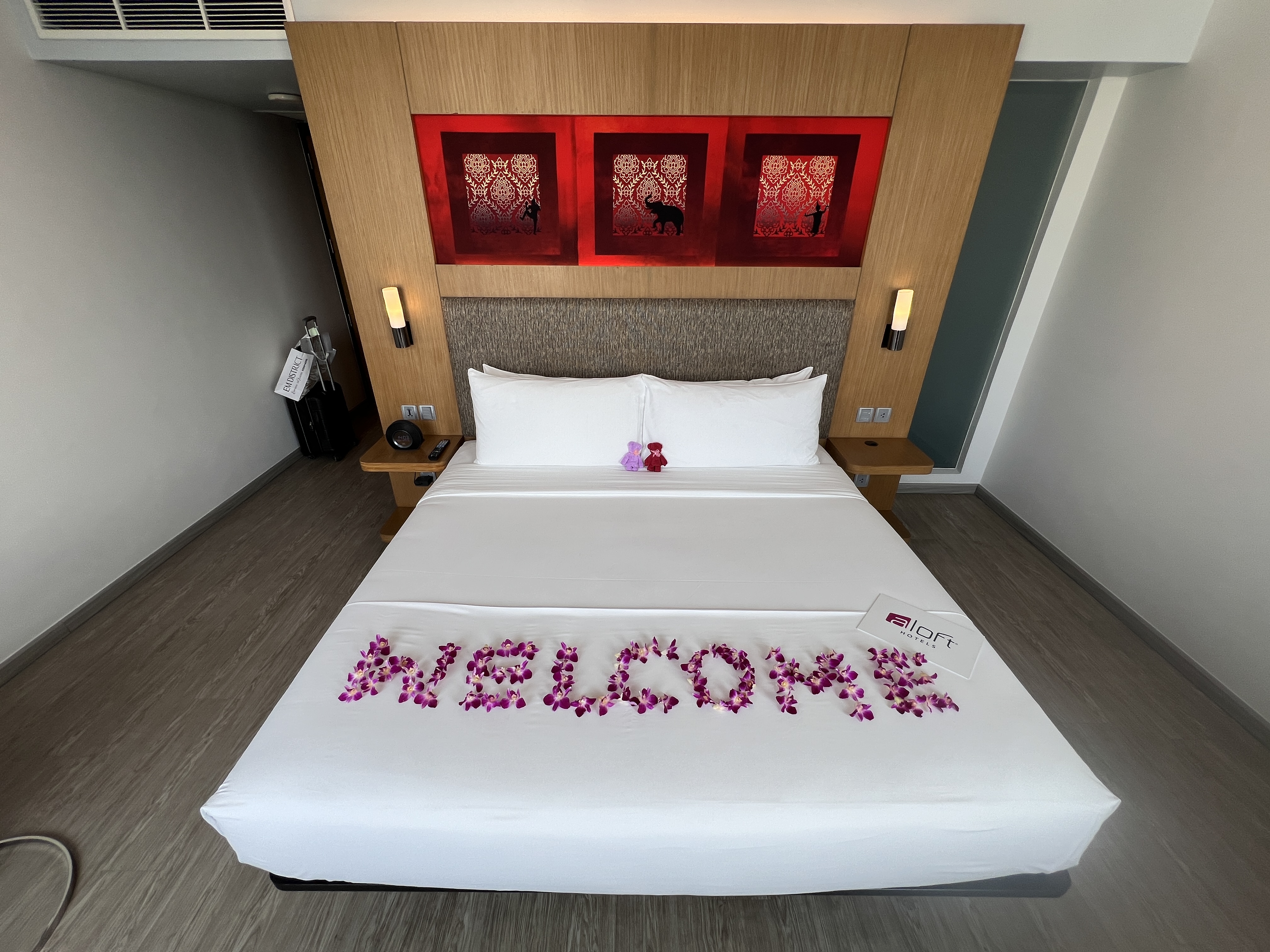 Aloft Bangkok Sukhumvit 11 bed with floral decorations Aloft Bangkok Sukhumvit 11 bed with floral decorations