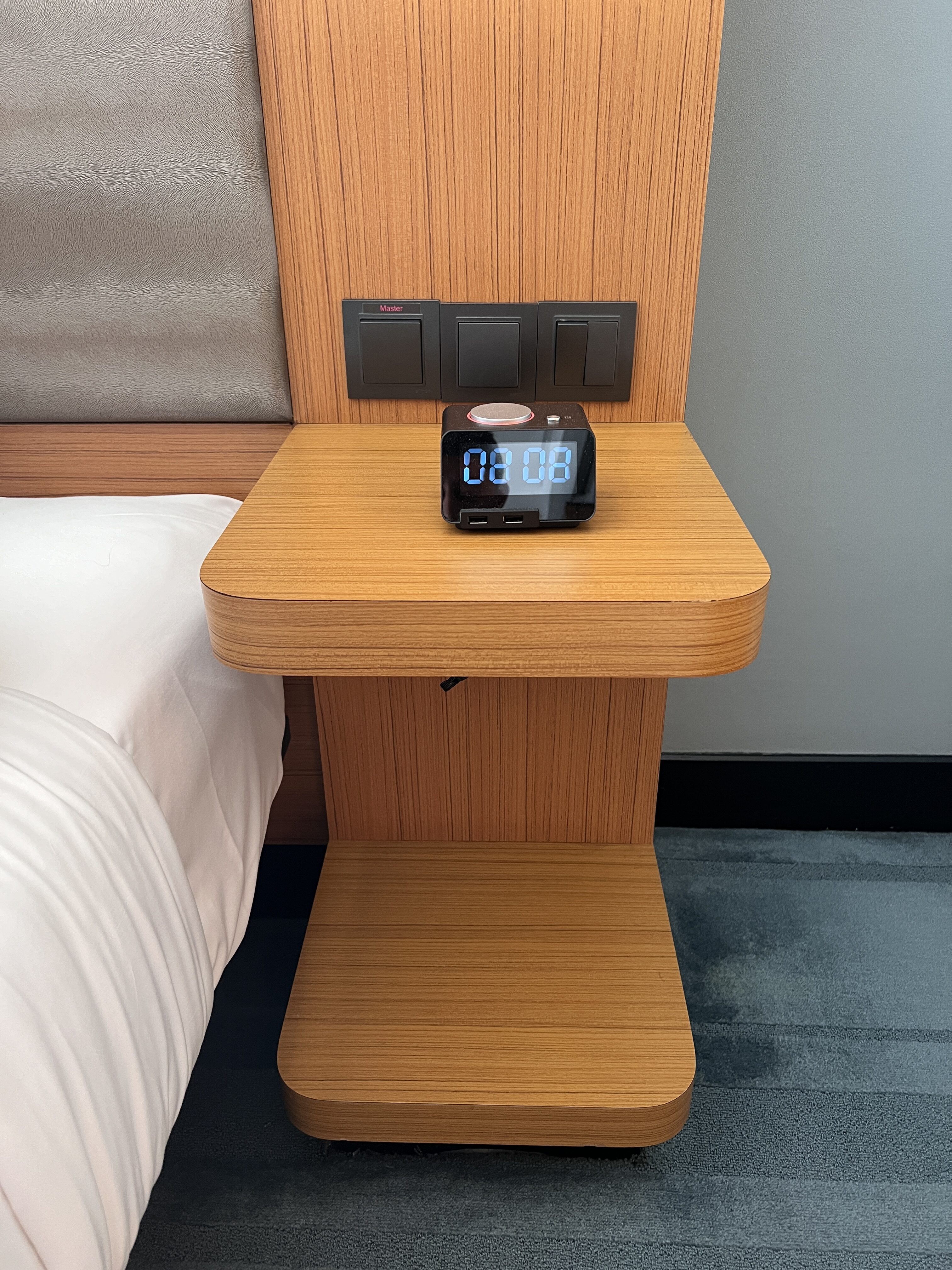 Aloft Kuala Lumpur Sentral nightstand with alarm clock Aloft Kuala Lumpur Sentral nightstand with alarm clock