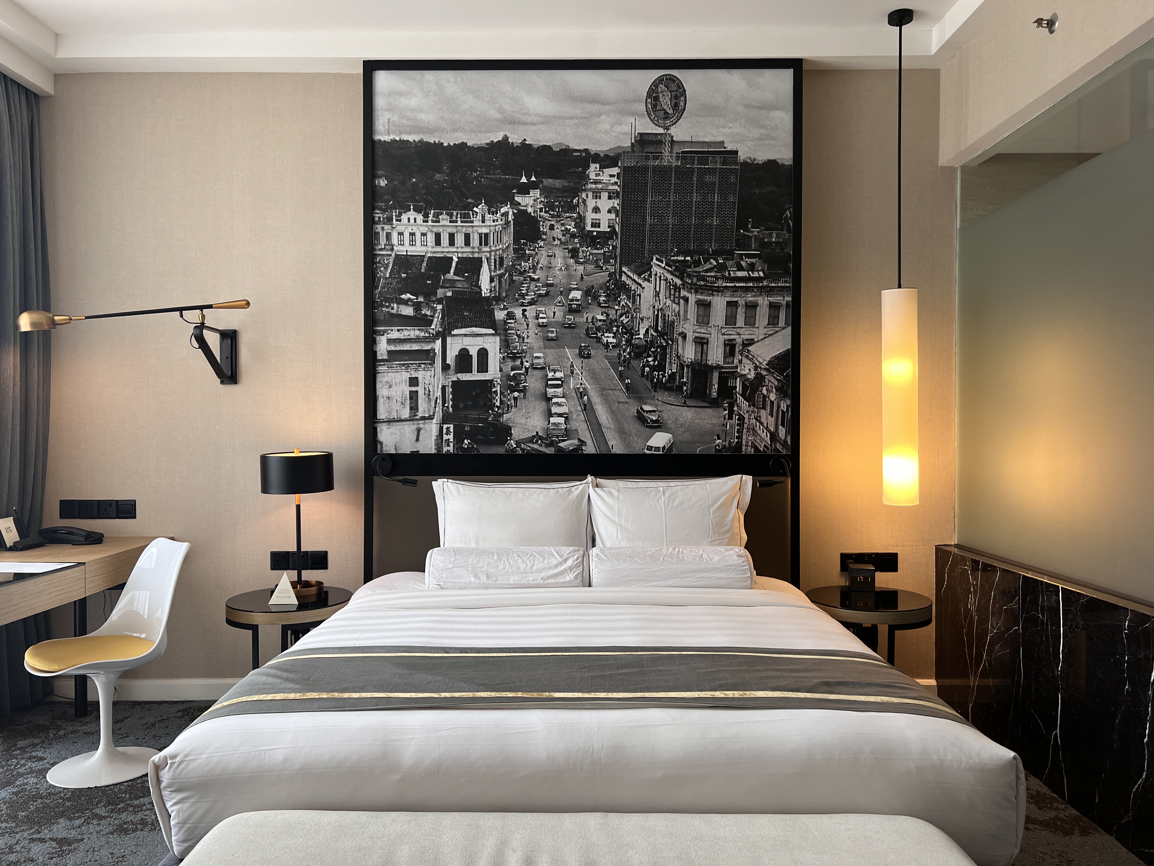 Hotel Stripes Kuala Lumpur Autograph Collection room bed and artwork Hotel Stripes Kuala Lumpur Autograph Collection room bed and artwork