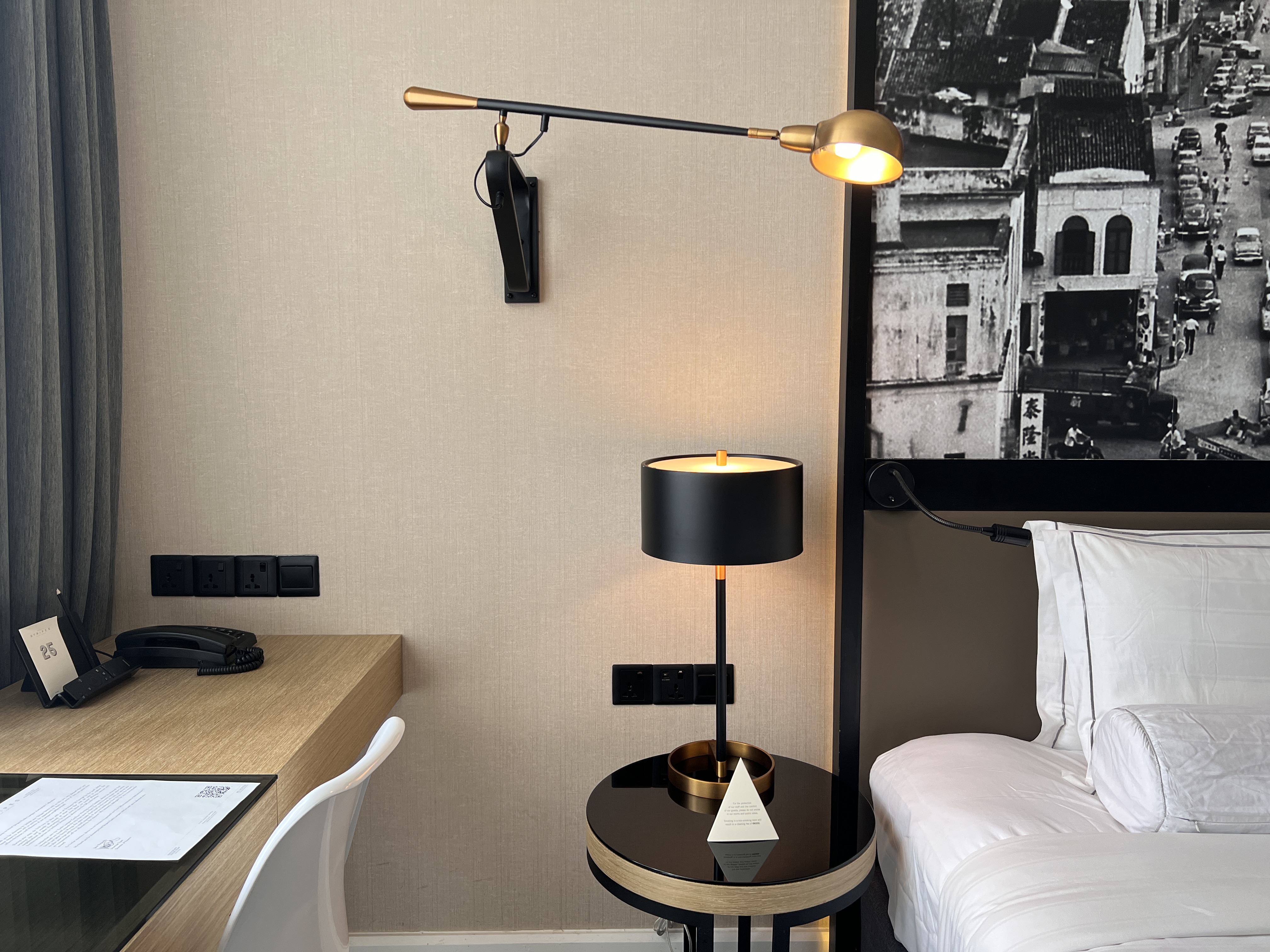 Hotel Stripes Kuala Lumpur Autograph Collection room nightstand and mounted wall lap Hotel Stripes Kuala Lumpur Autograph Collection room nightstand and mounted wall lap