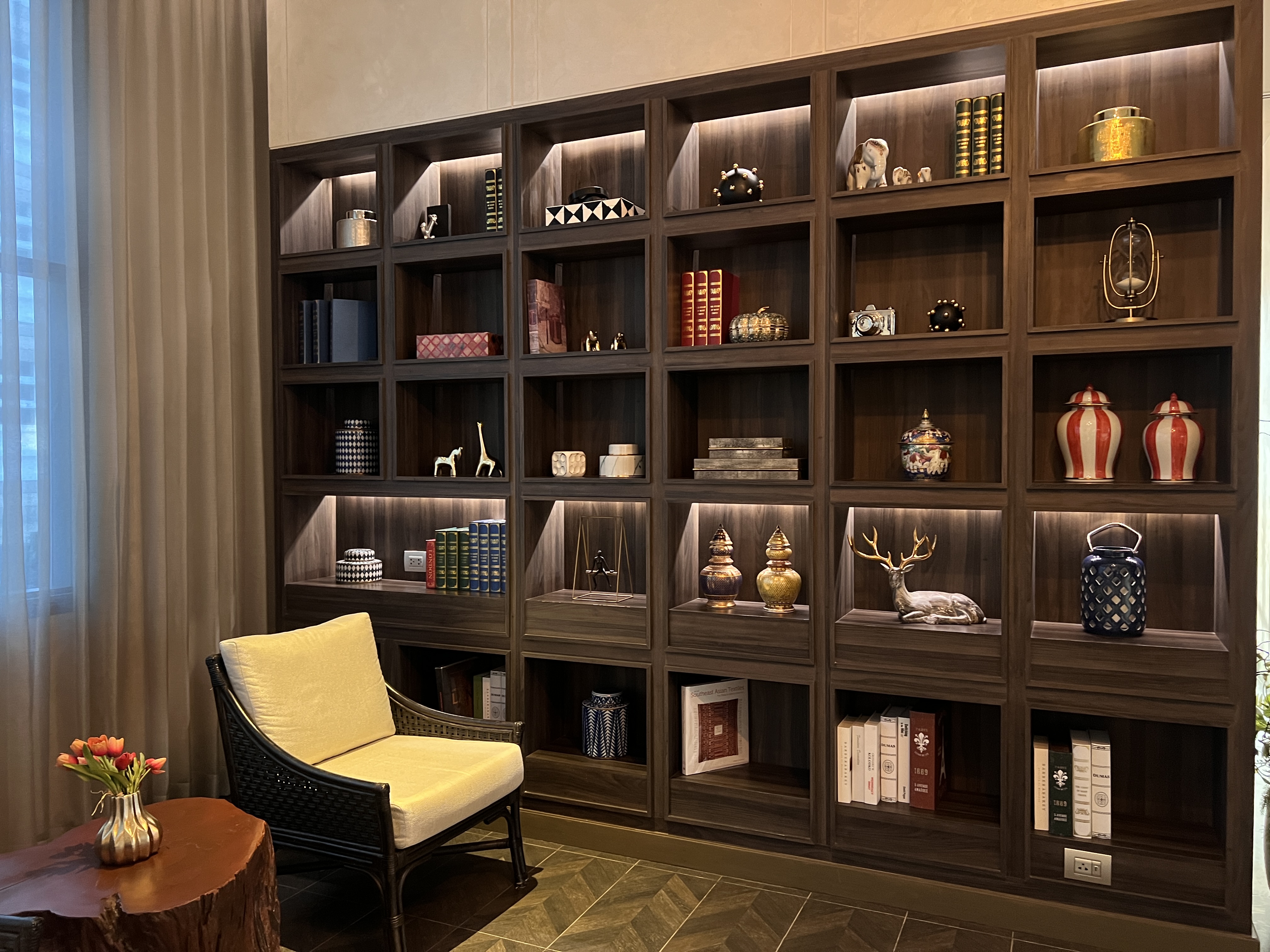 Hyatt Place Bangkok Sukhumvit lobby bookshelf and artwork