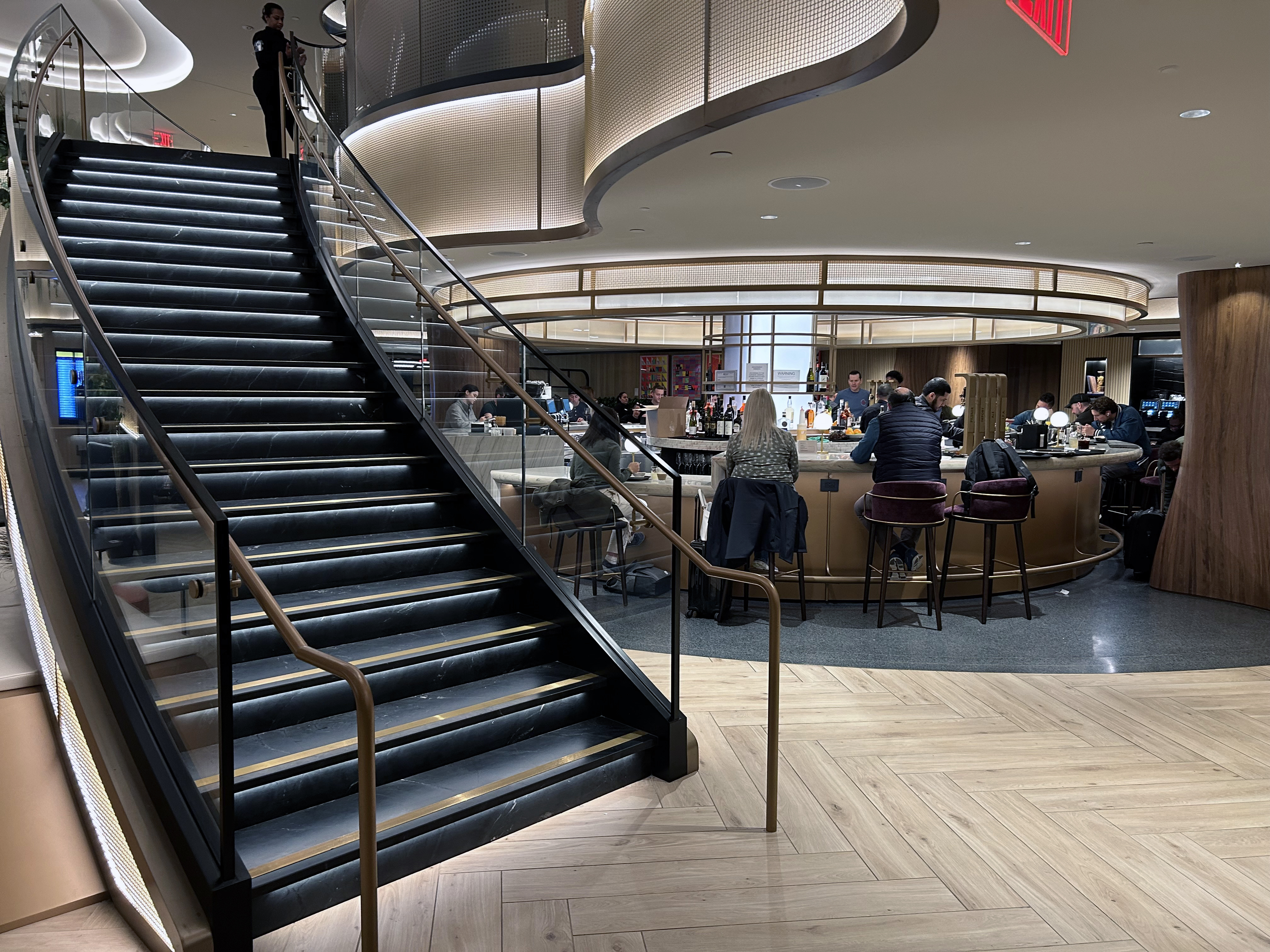 LGA Sapphire Lounge stairs and bar