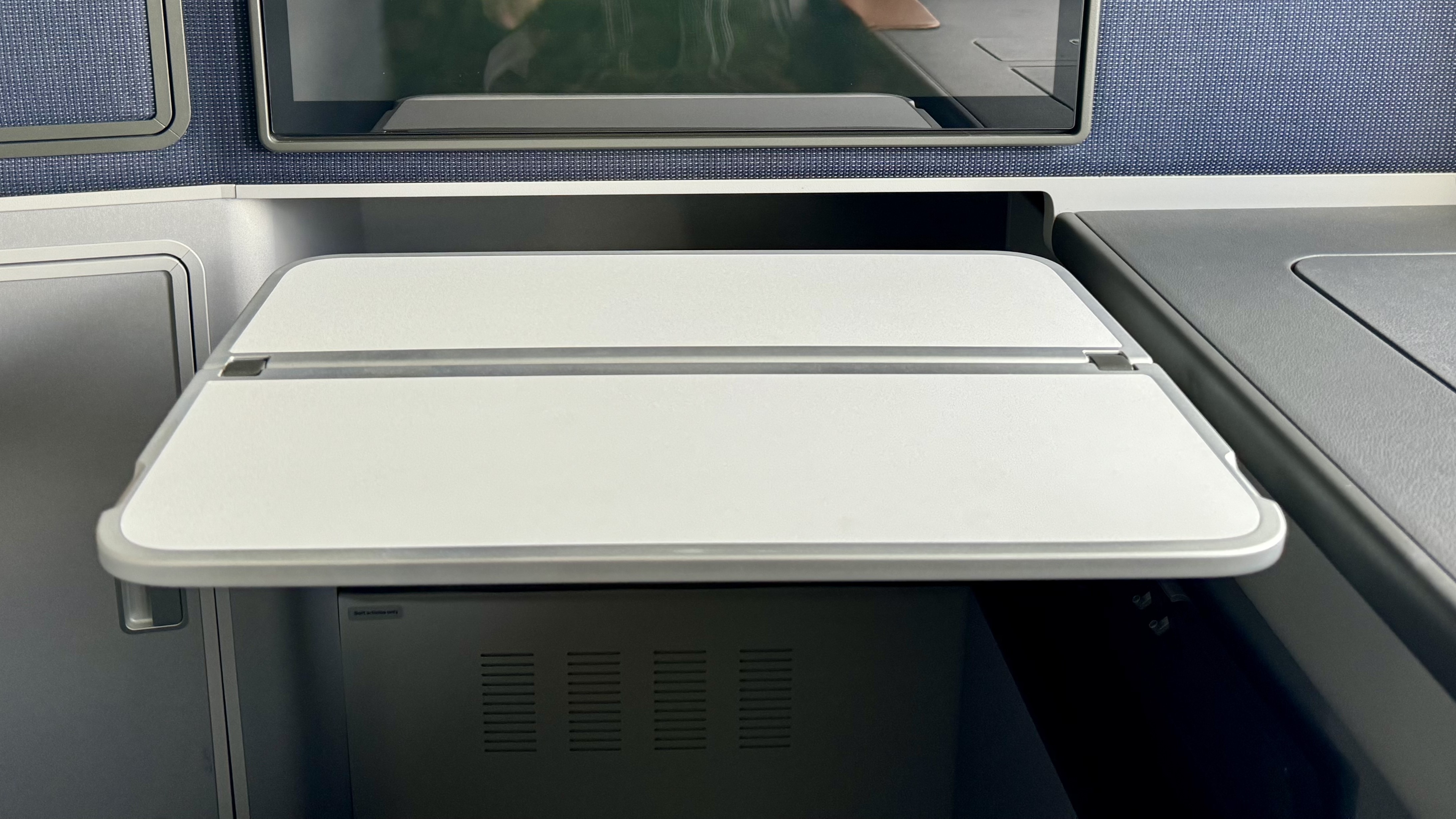 Lufthansa Allegris Business Suite tray table extended