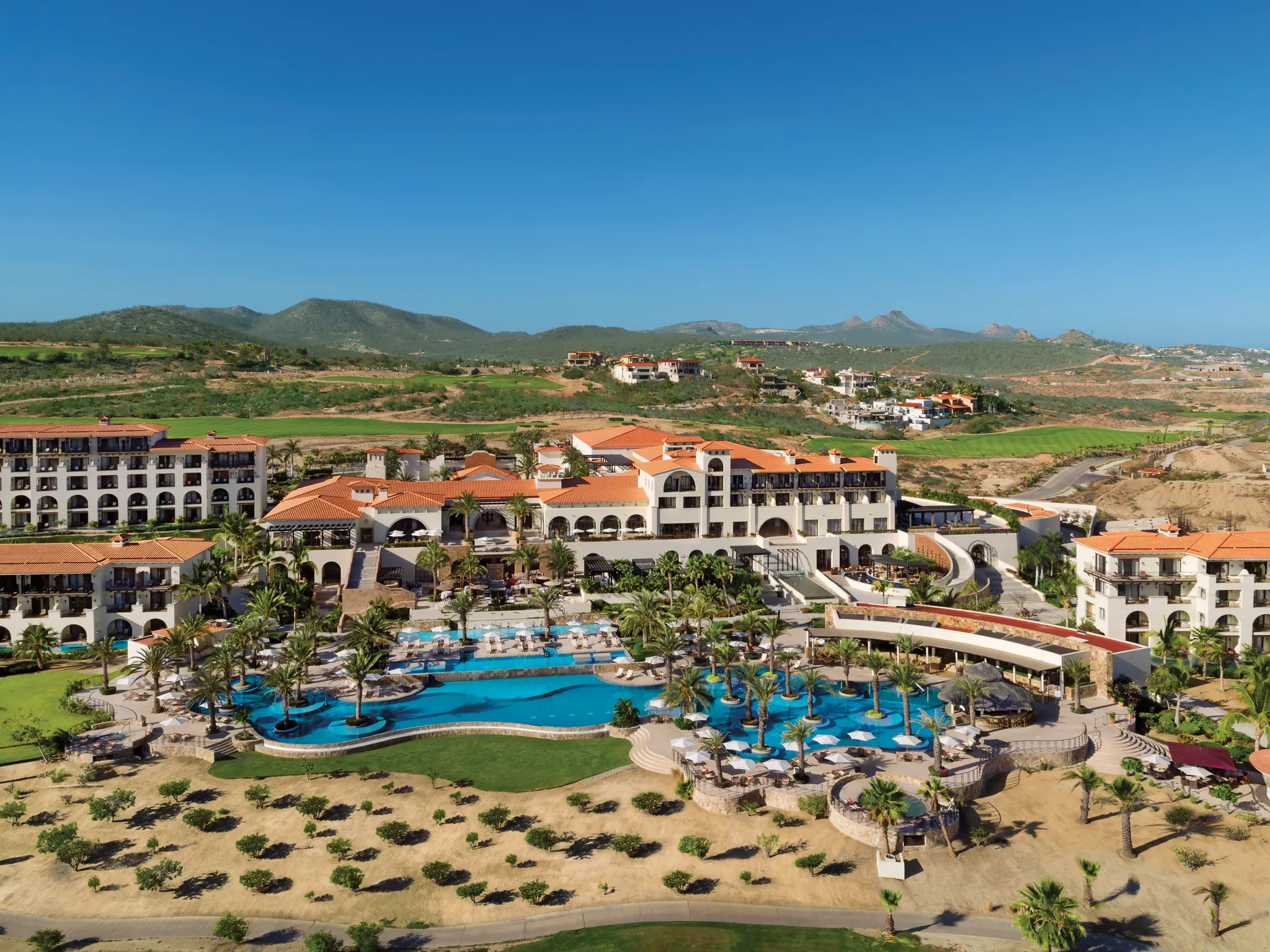 Secrets Puerto Los Cabos Golf and Spa Resort The pool and hotel view of Secrets Puerto Los Cabos Golf and Spa Resort.