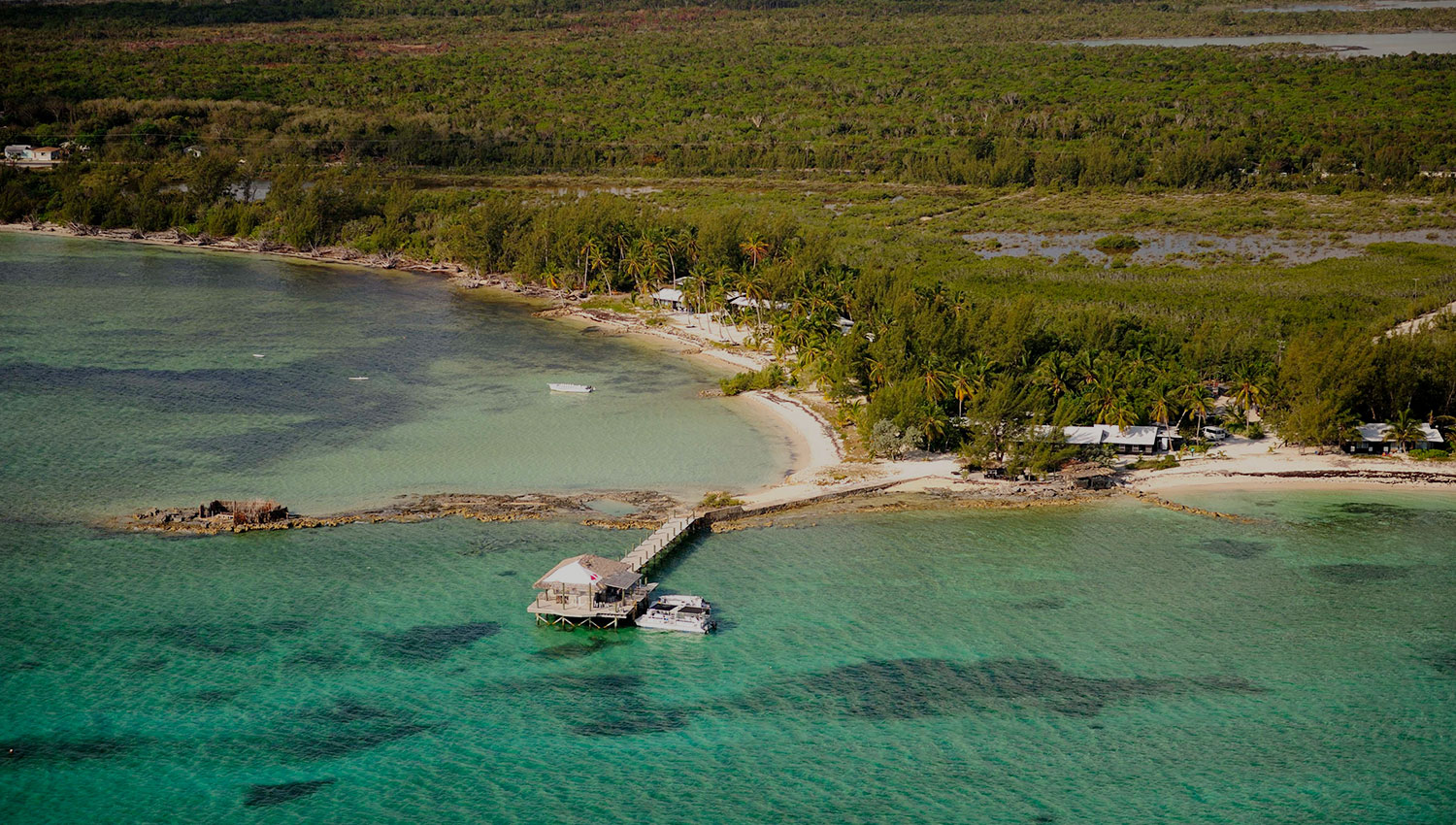 Small Hope Bay Lodge An aerial photo of Small Hope Bay Lodge from the ocean.
