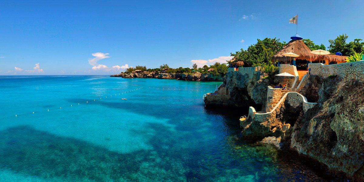 The Caves Jamaica Image of The Caves Jamaica along a cliff.