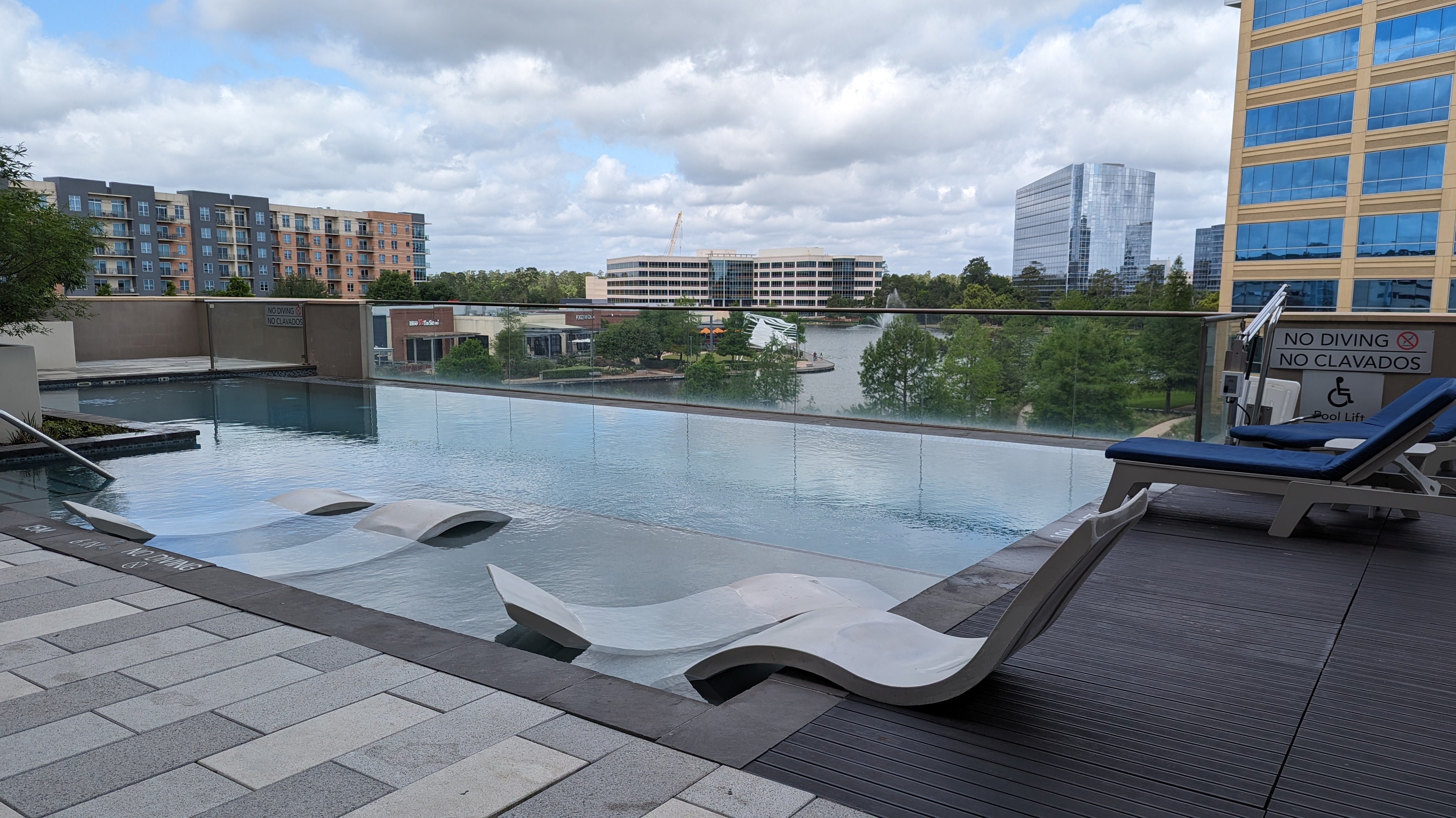 Embassy Suites by Hilton The Woodlands at Hughes Landing amenities pool view
