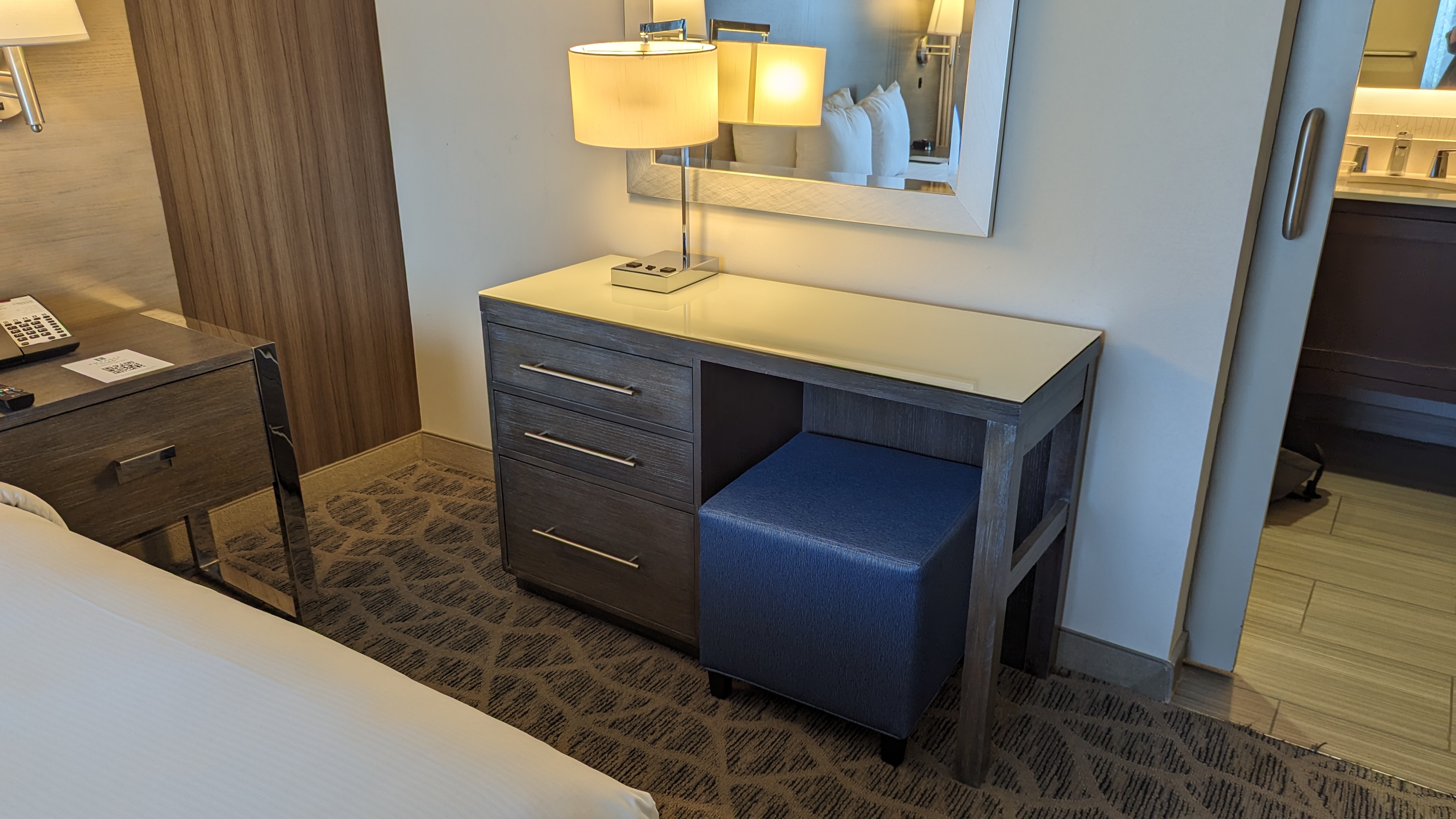 Embassy Suites by Hilton The Woodlands at Hughes Landing room bedroom dresser desk