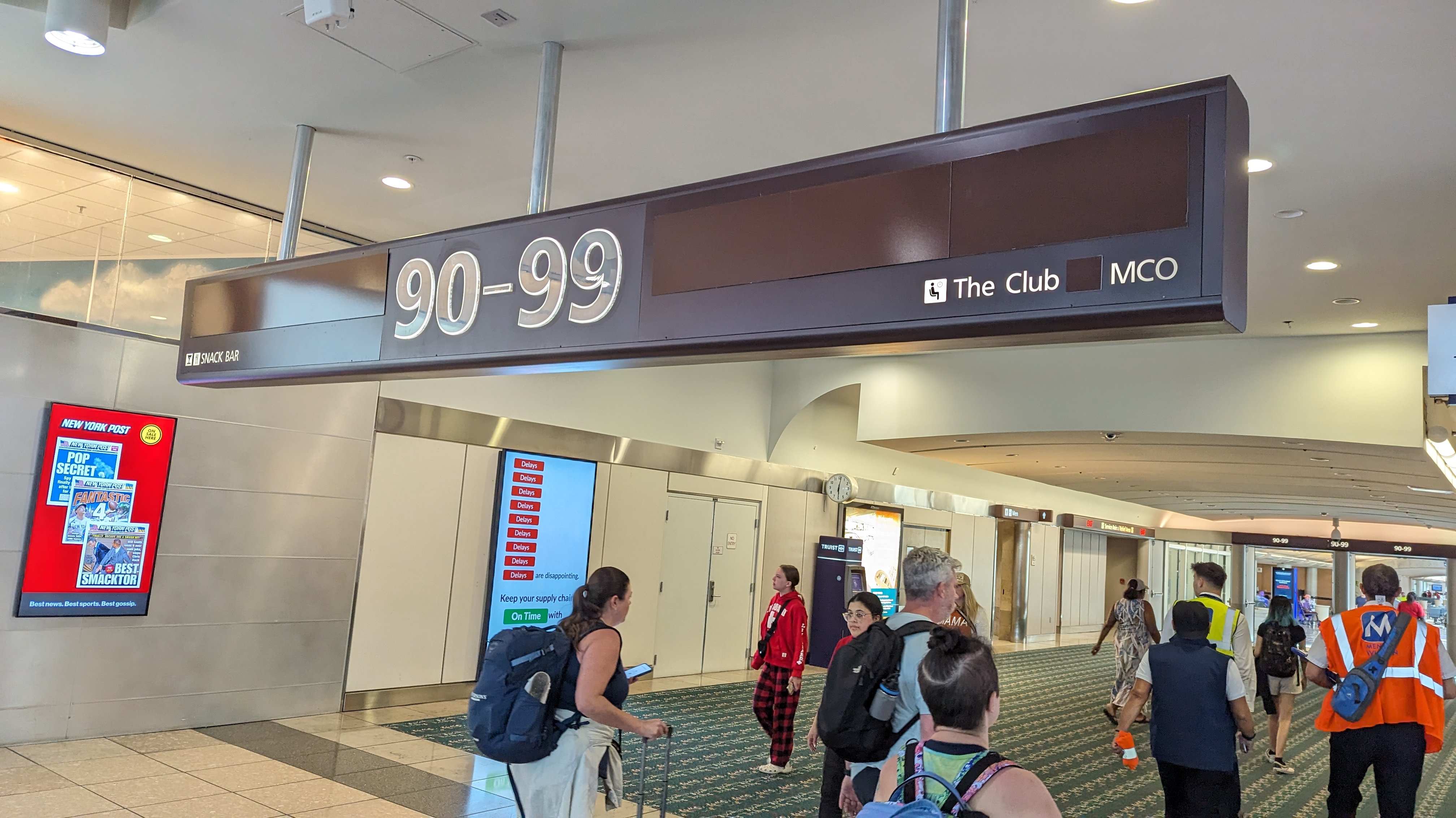 MCO Terminal B gates 70 99 The Club direction sign