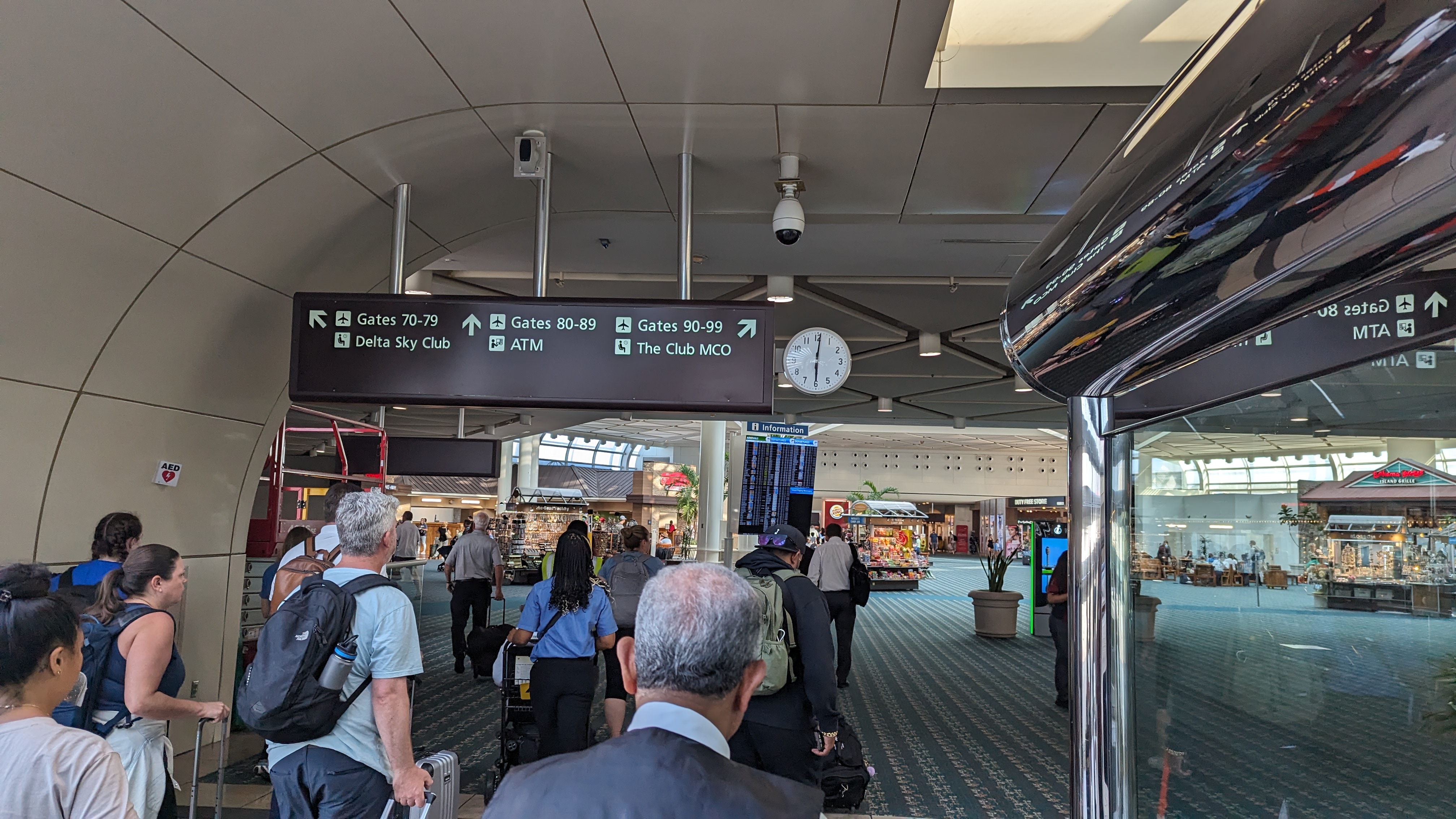 MCO Terminal B gates 70 99 entry sign