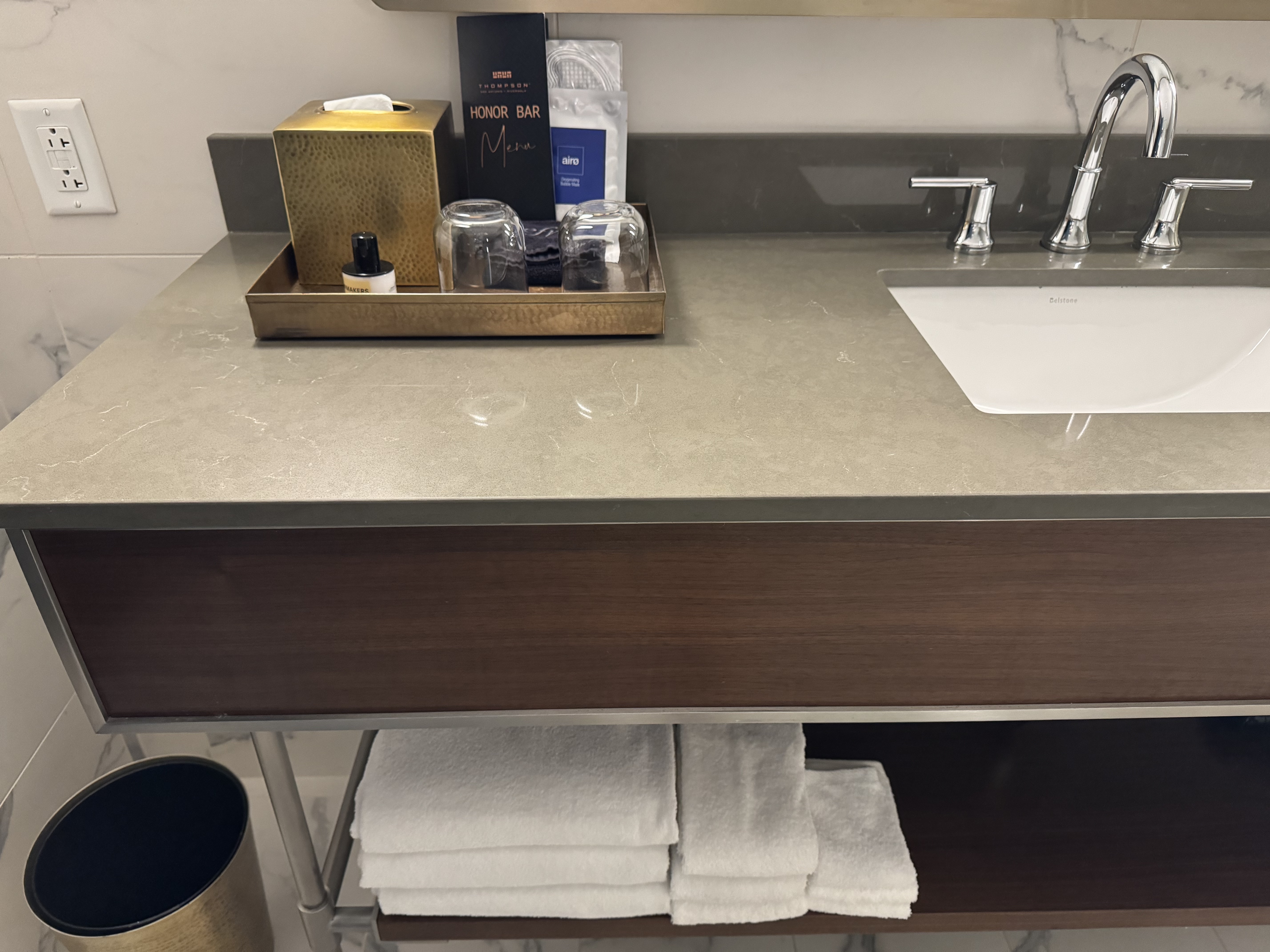 Thompson San Antonio Riverwalk bathroom counter with toiletries and towels Thompson San Antonio Riverwalk bathroom counter with toiletries and towels
