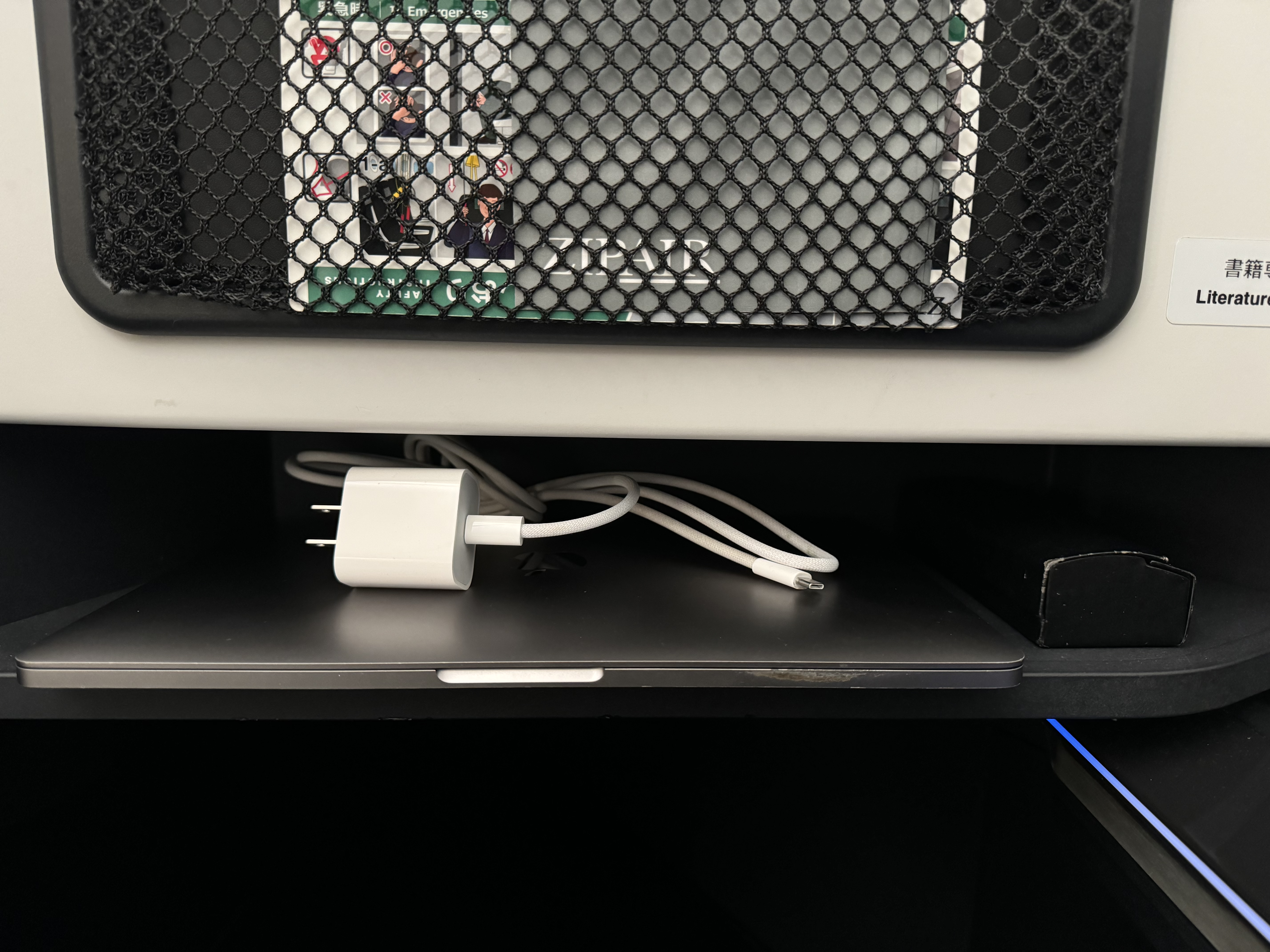 Zipair LAX NRT business class storage at front of seat Zipair LAX NRT business class storage at front of seat
