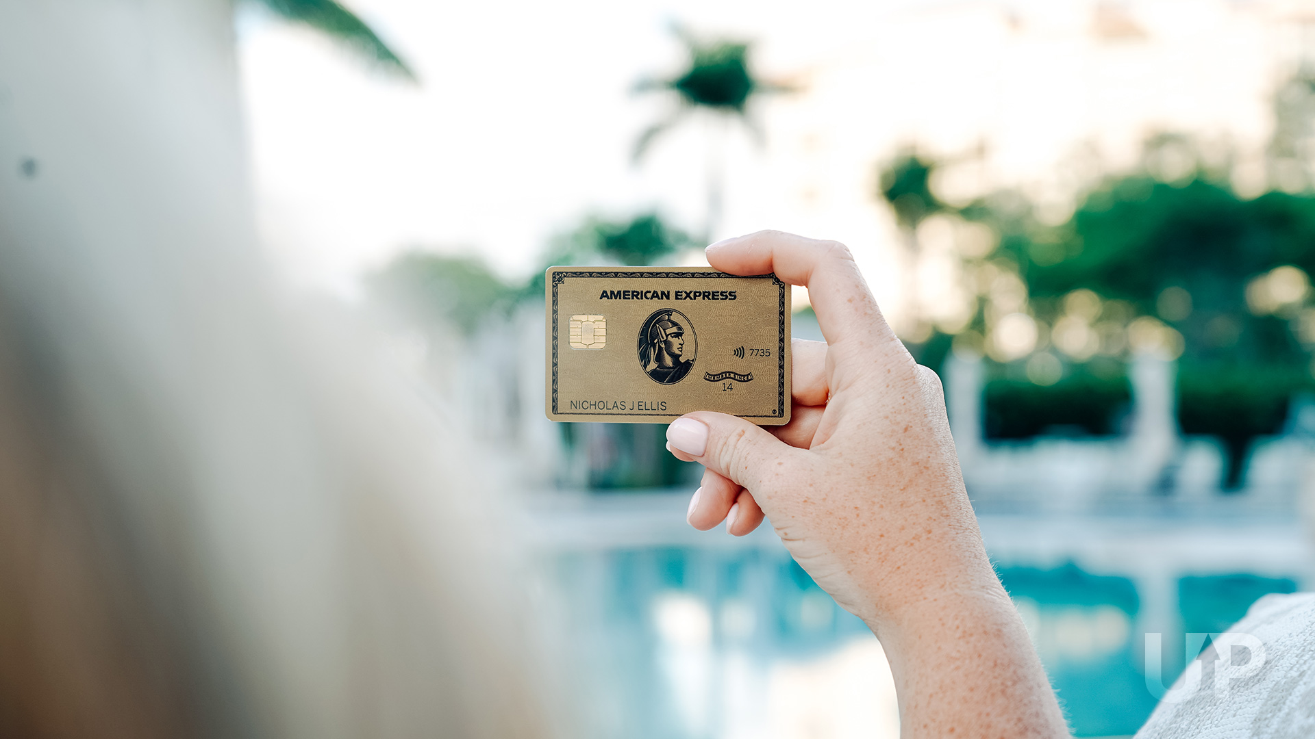 Amex Gold Card against green background Amex Gold in Hand Pool Upgraded Points LLC 2