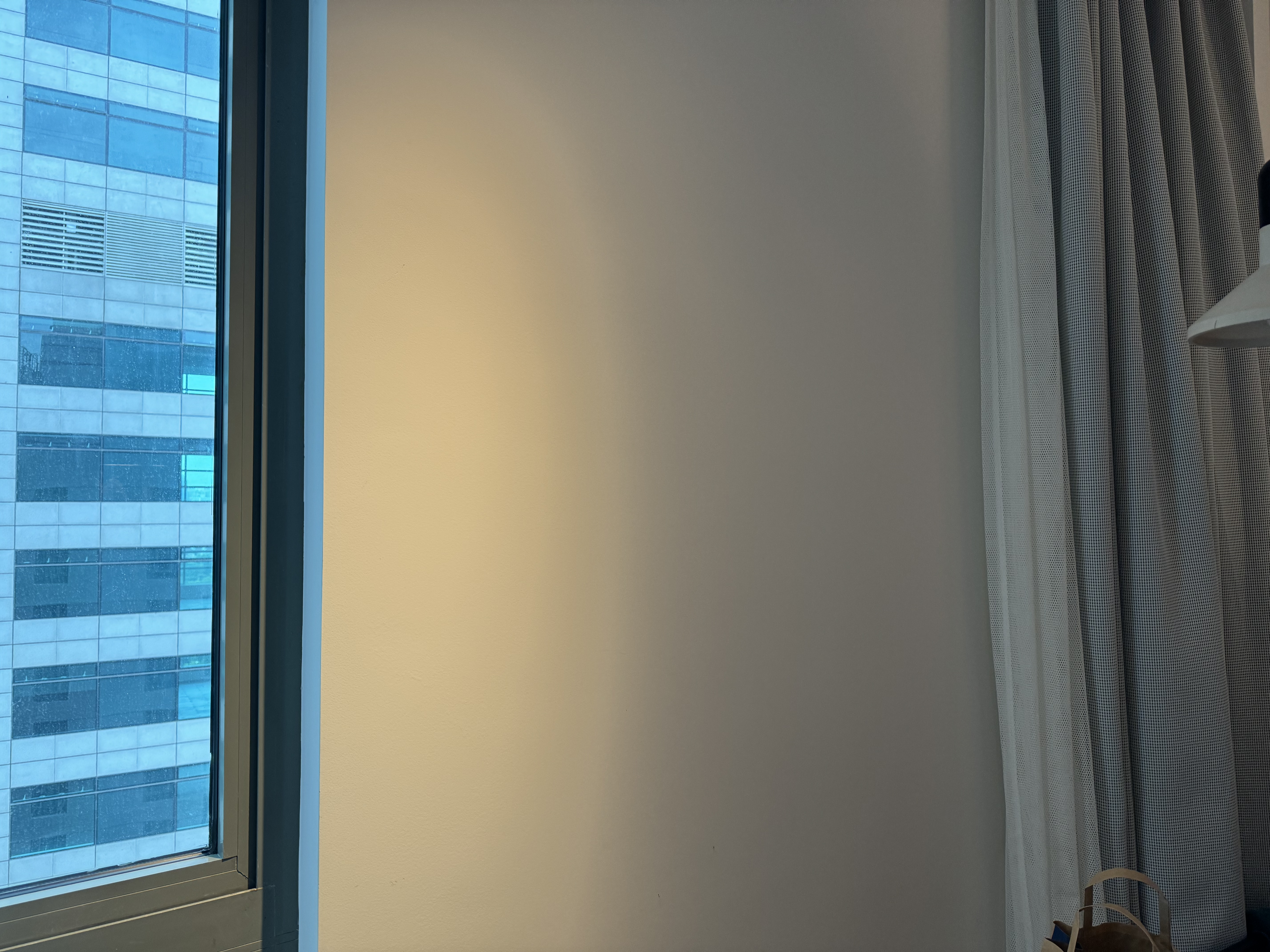 Caption by Hyatt Zhongshan Park Shanghai bedroom wall behind curtain