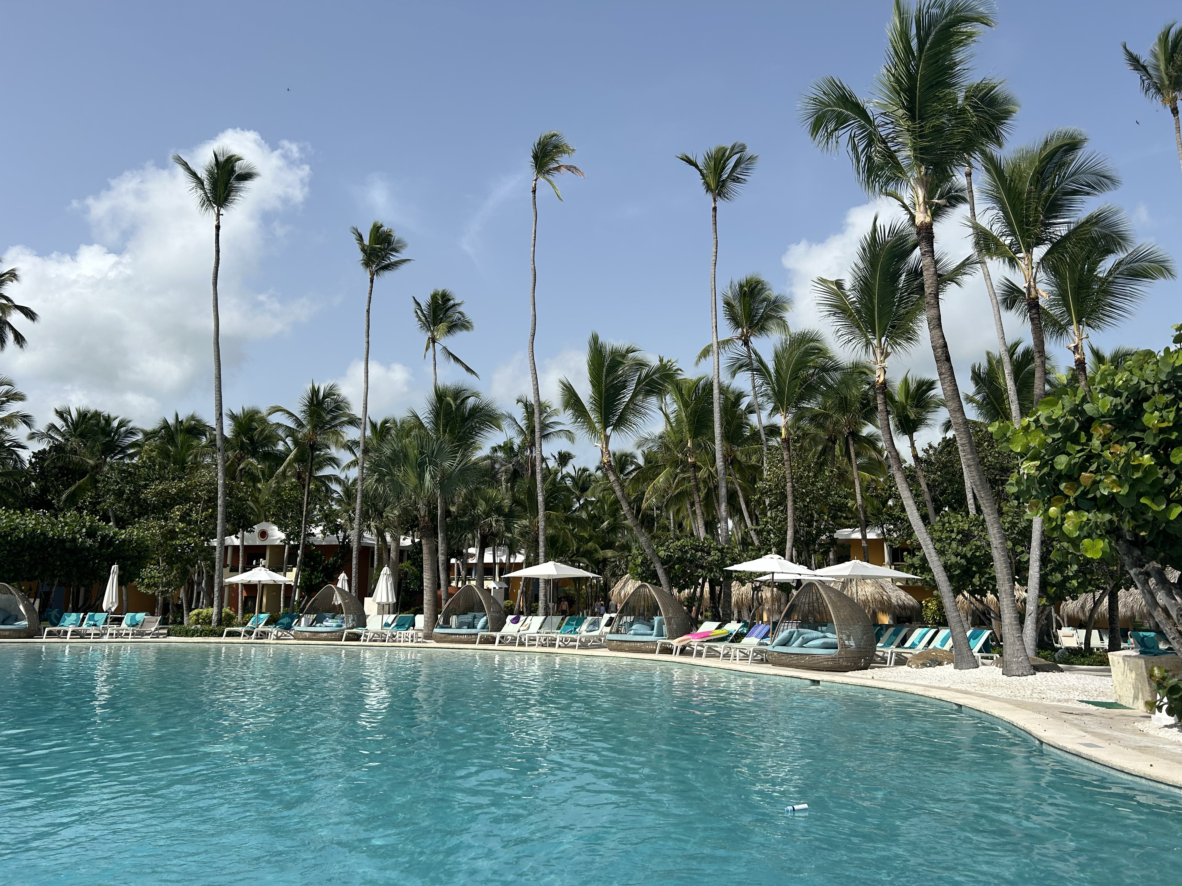 Iberostar Selection Bavaro Suites pool and palm trees Iberostar Selection Bavaro Suites reserving chairs