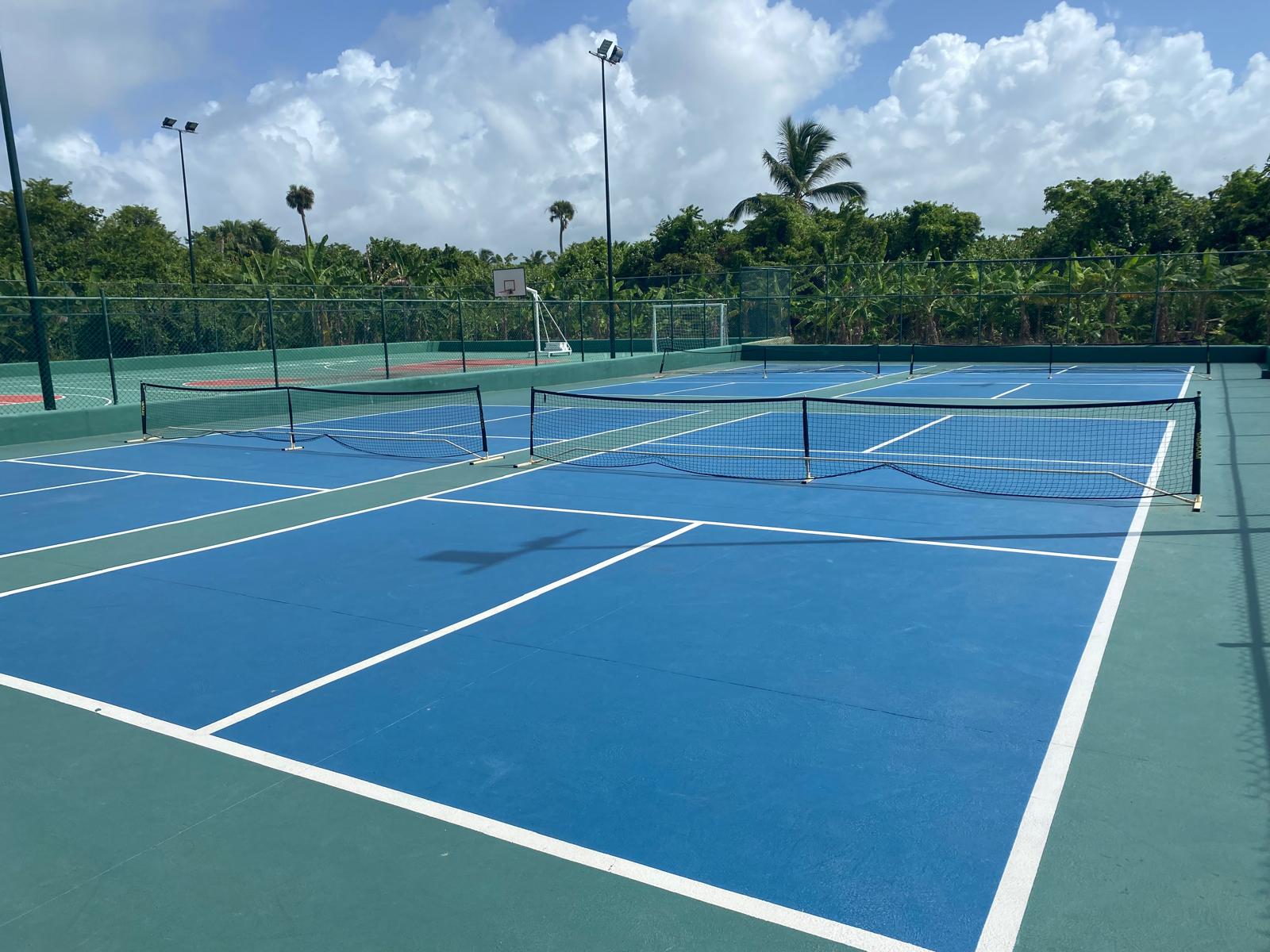 Iberostar Selection Bavaro Suites tennis courts Iberostar Selection Bavaro Suites blue and green tennis courts