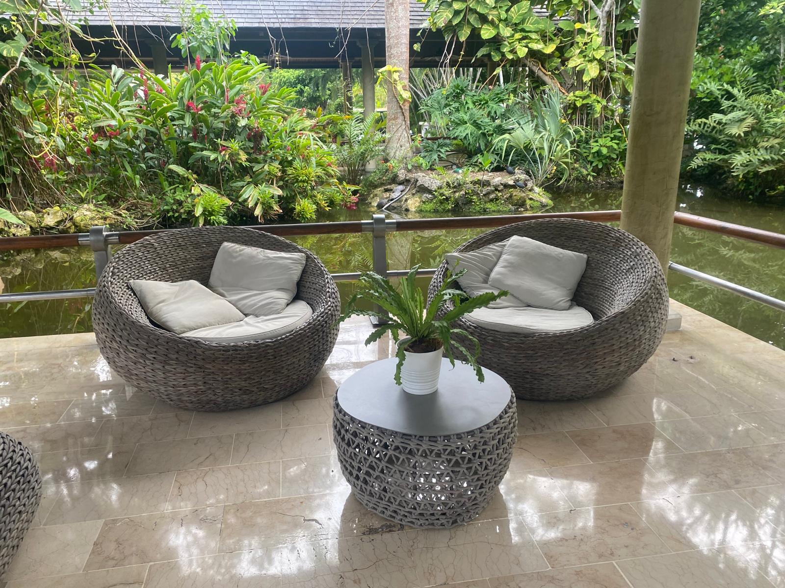 Iberostar Selection Bavaro Suites peaceful corner Iberostar Selection Bavaro Suites table, chairs, and pond