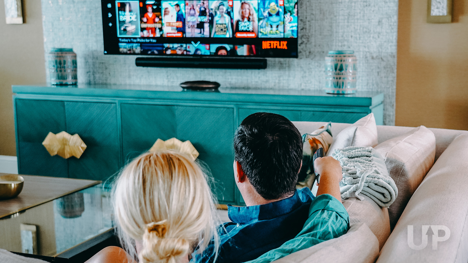 Man trying to fix broken tv Netflix Streaming on TV Upgraded Points LLC 2