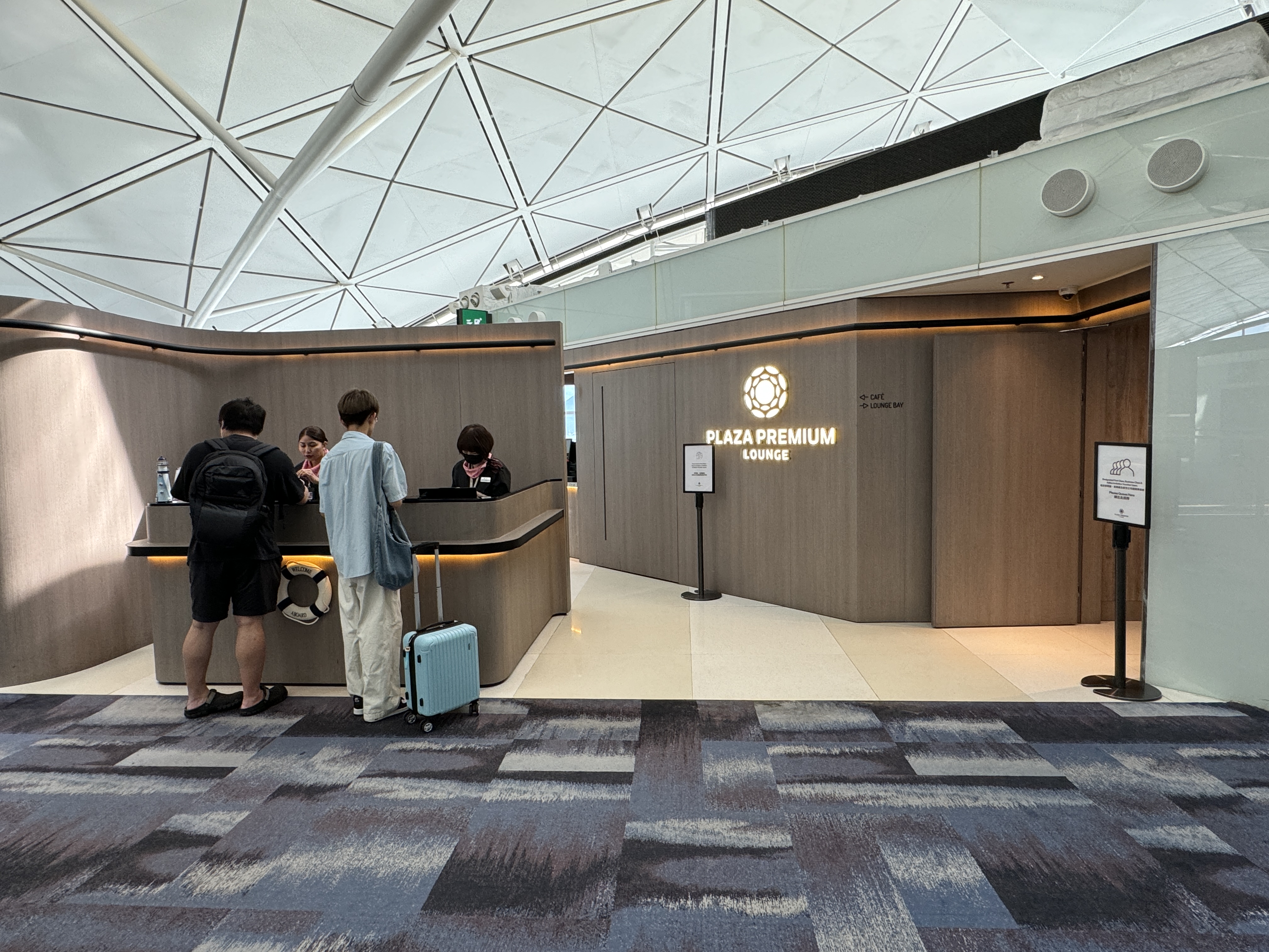 Plaza Premium Lounge HKG Gate 60 entry with guests