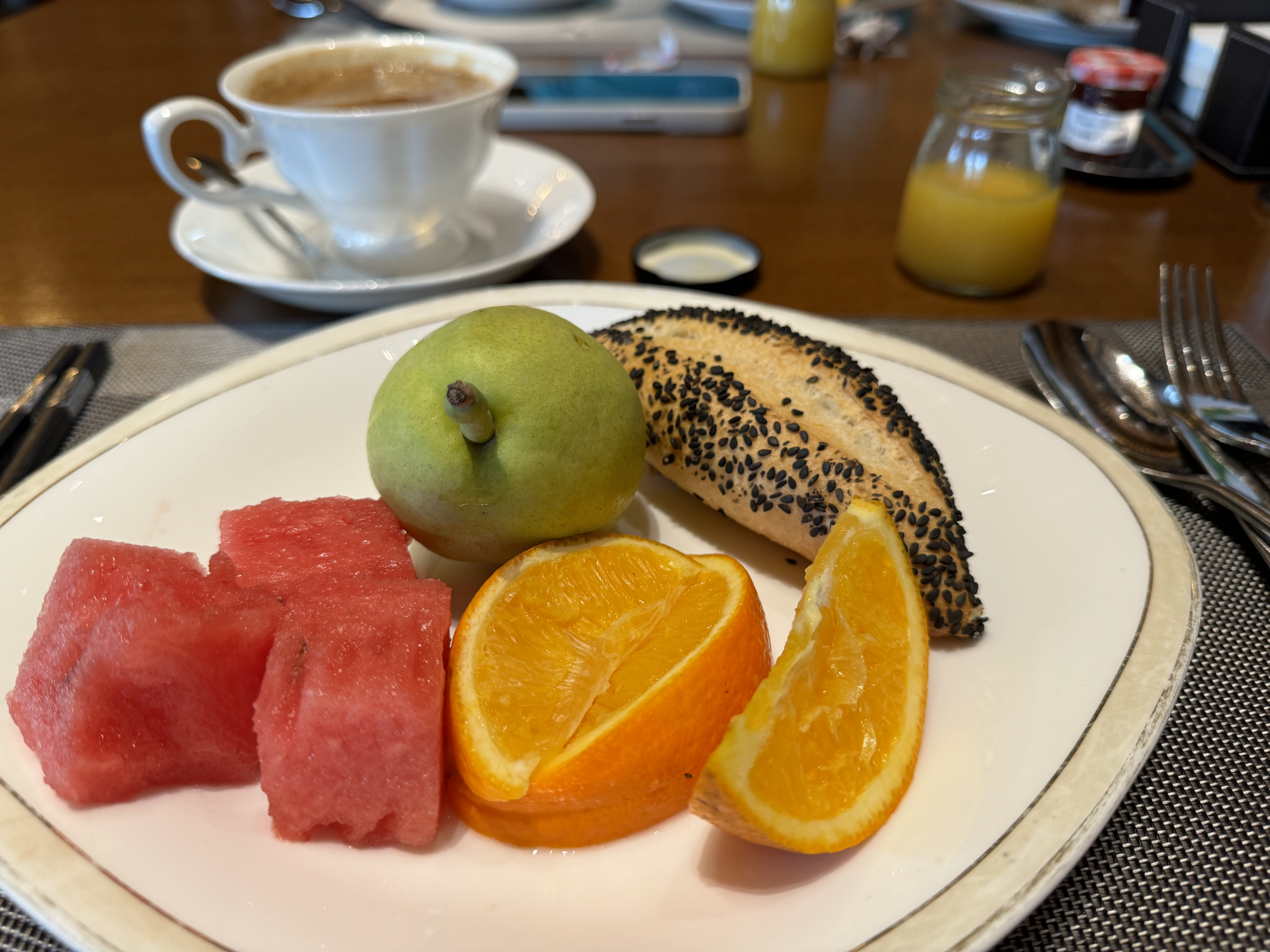 St Regis Lhasa Social fruit and bread on plate St Regis Lhasa Social fruit and bread on plate