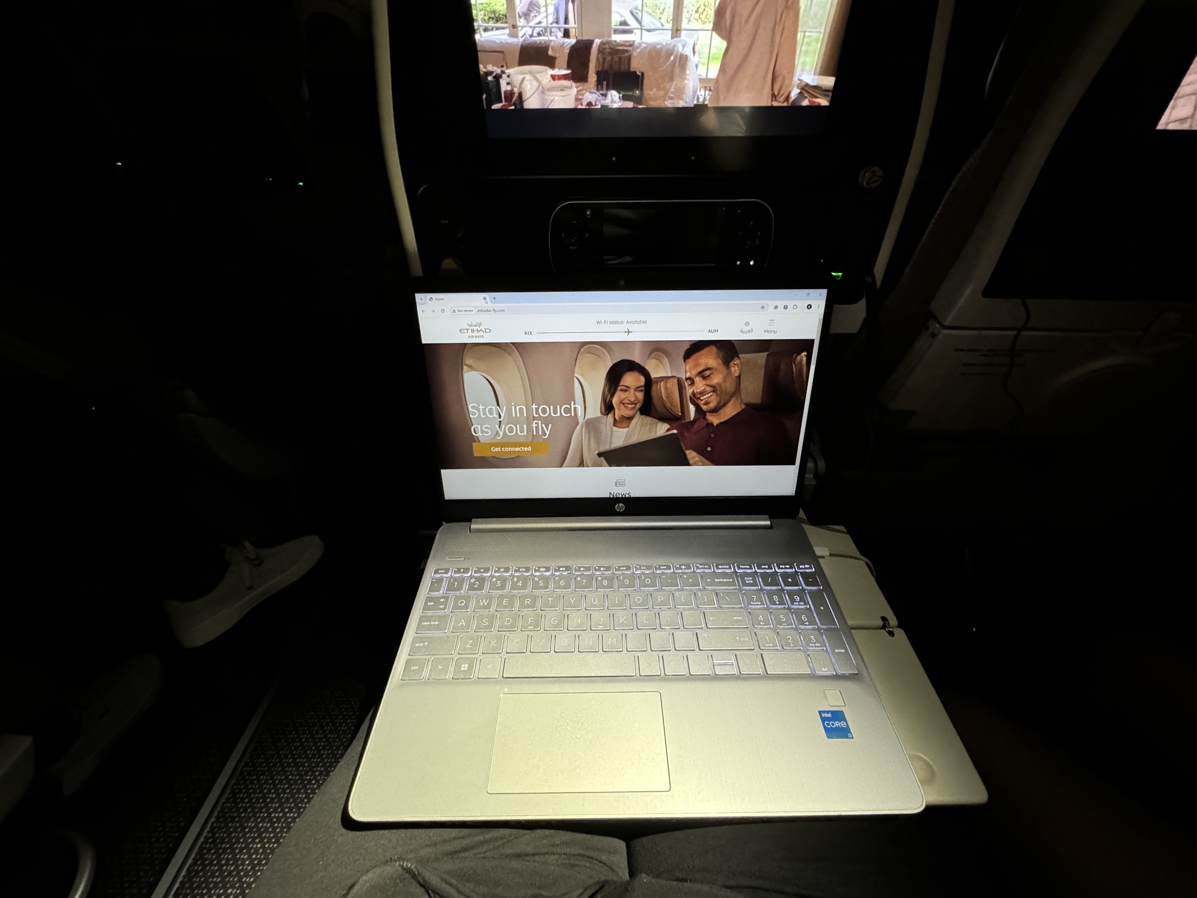 Etihad B787 9 Economy KIX AUH laptop on tray table