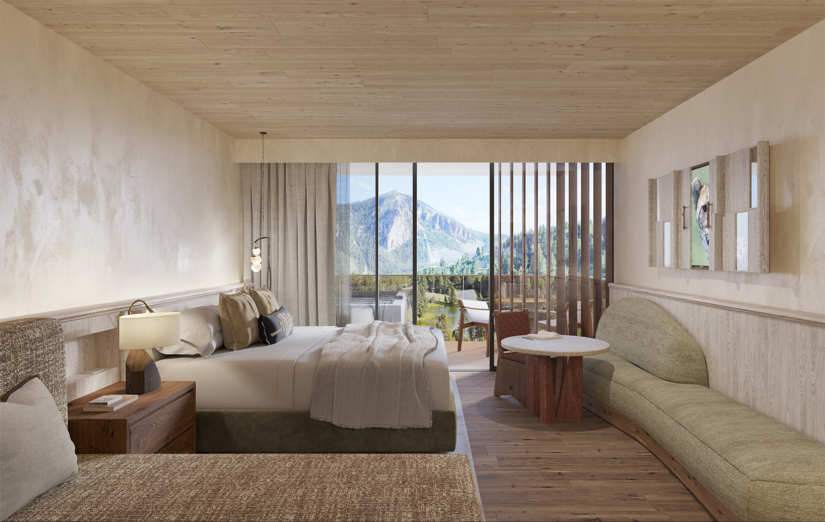a bedroom at a luxury hotel with mountain peaks visible from the window