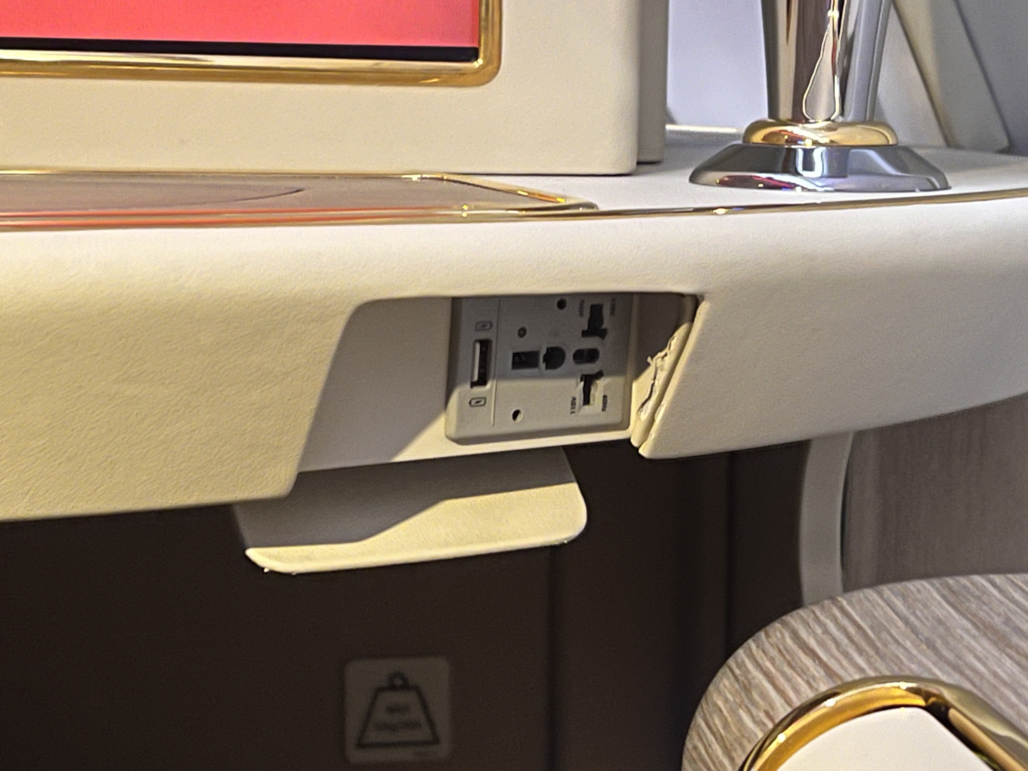 Emirates First A380 seat AC power outlet Emirates First A380 seat AC power outlet