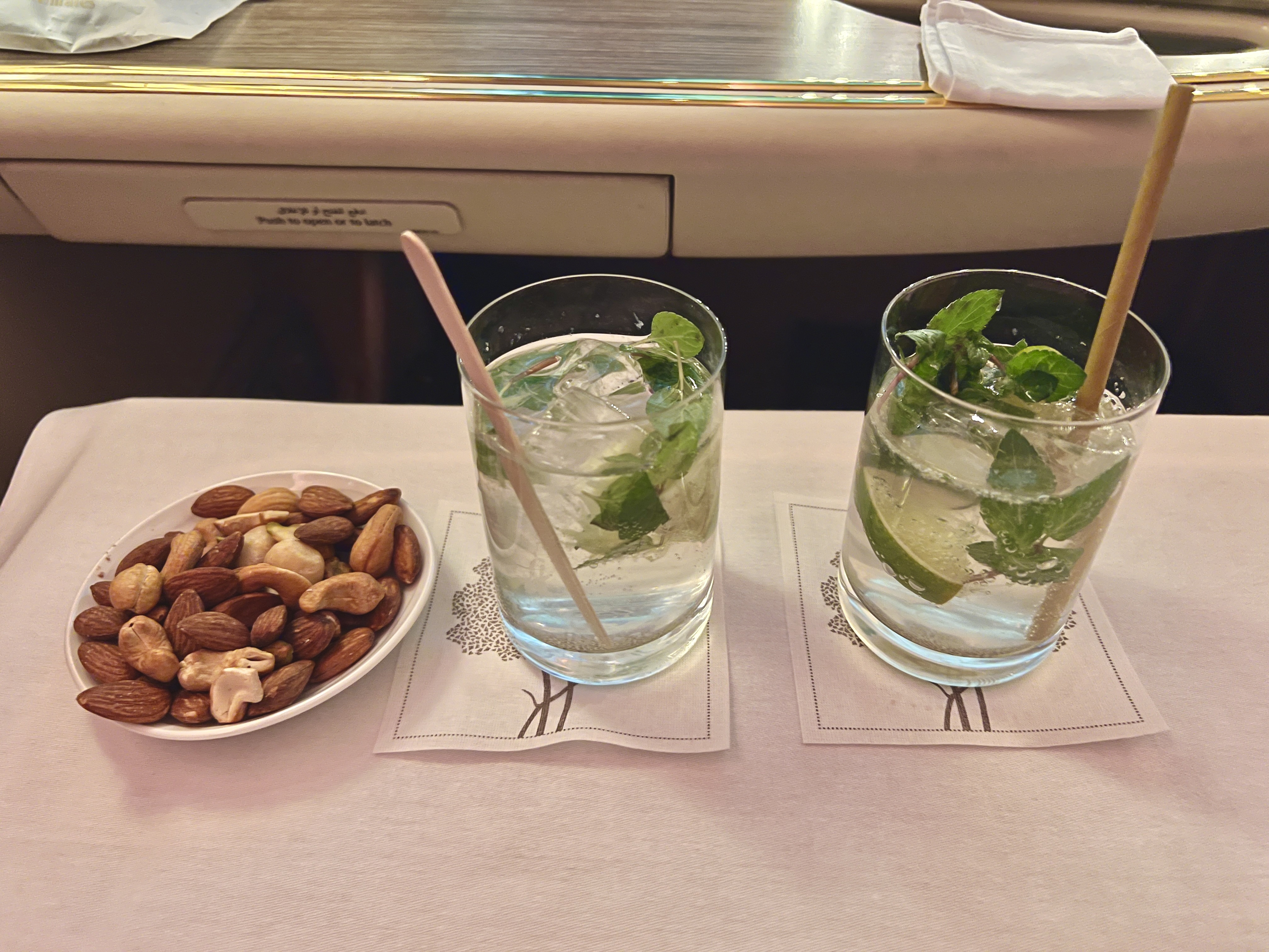 Emirates First A380 welcome drink and nuts Emirates First A380 welcome drink and nuts