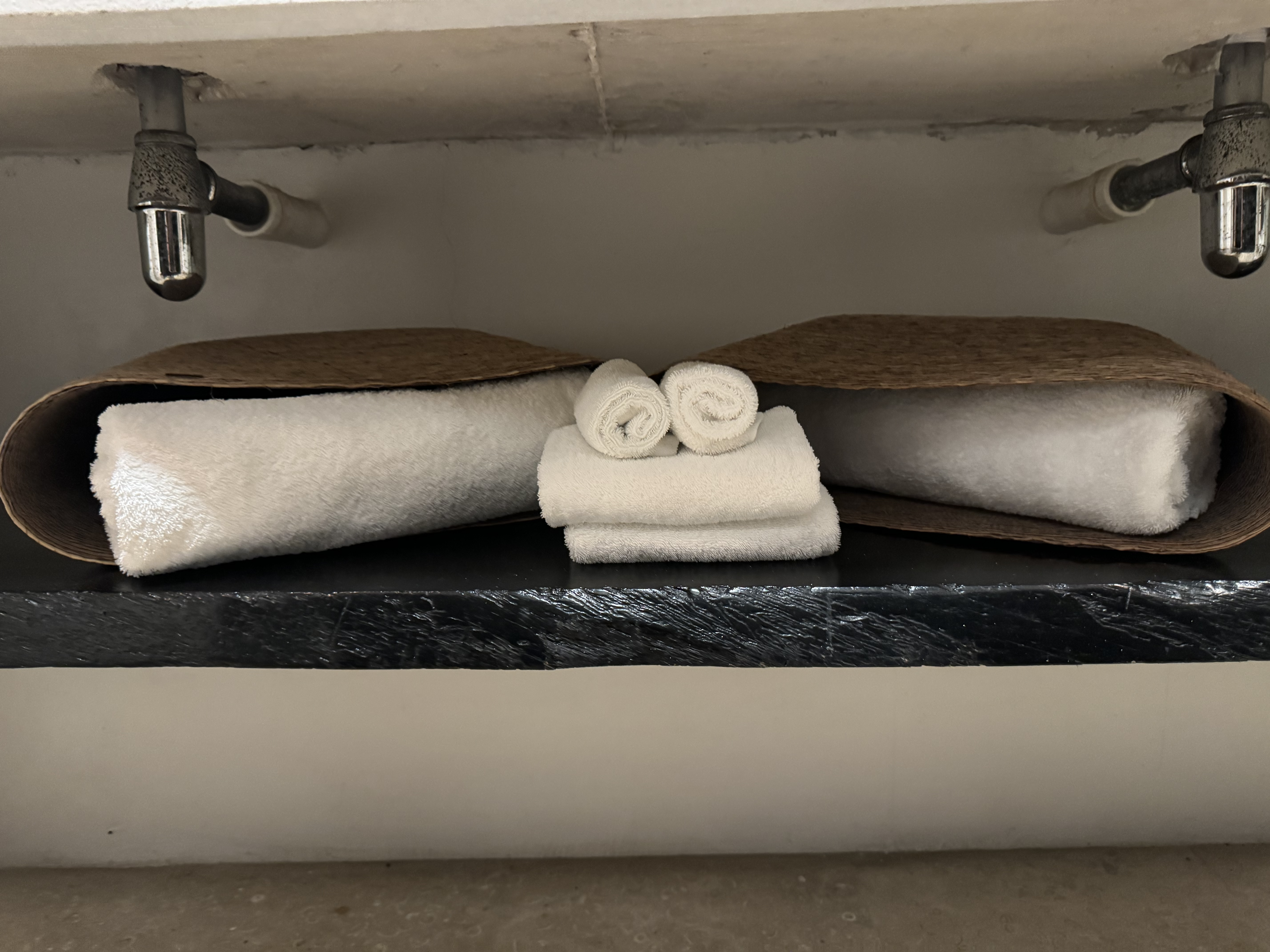 Matachica Resort Belize Mr Mrs Smith bathroom towels bags Matachica Resort Belize Mr Mrs Smith bathroom towels bags
