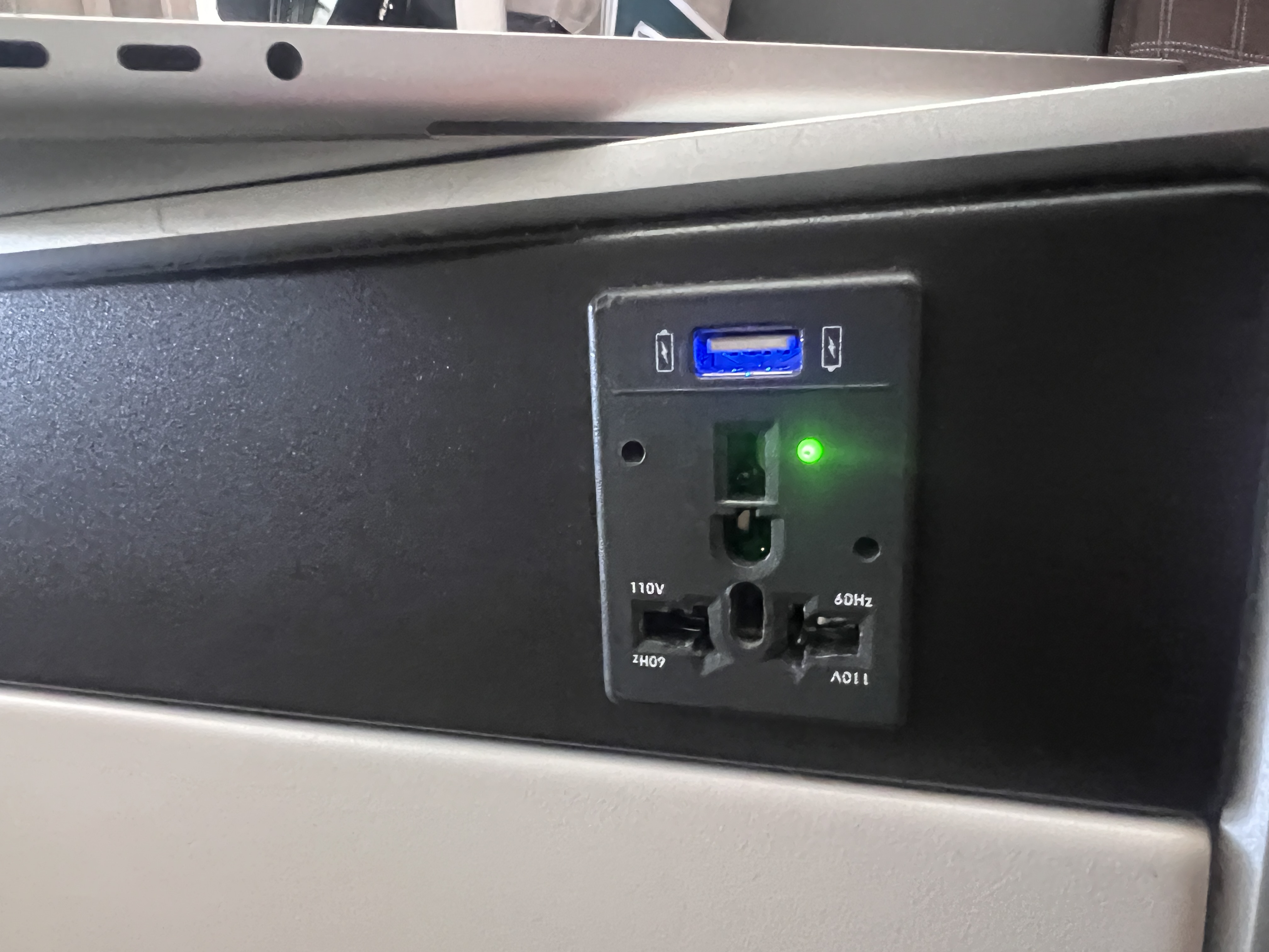 Swiss 777 business class seat AC power outlet Swiss 777 business class seat AC power outlet