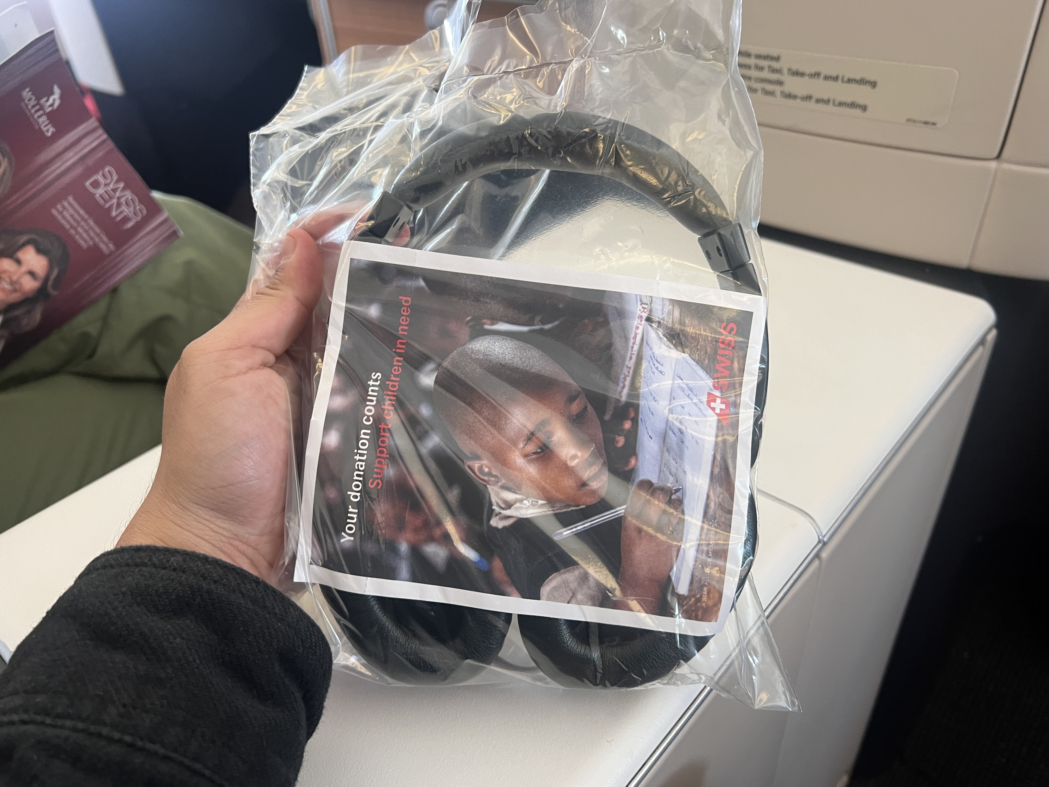 Swiss 777 business class wrapped headphones Swiss 777 business class wrapped headphones