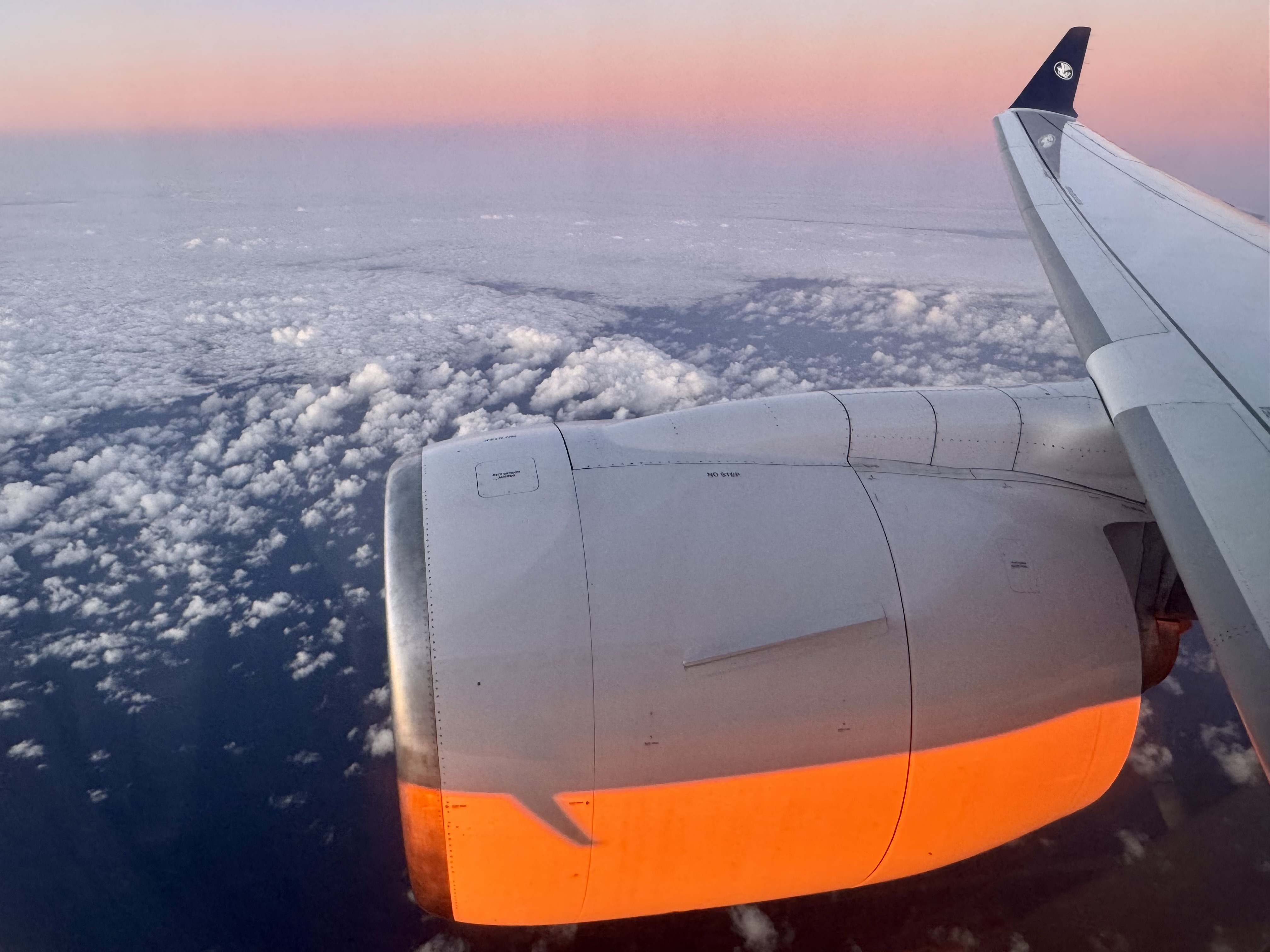 Air France Airbus A220 economy sunrise wing view Air France Airbus A220 economy sunrise wing view