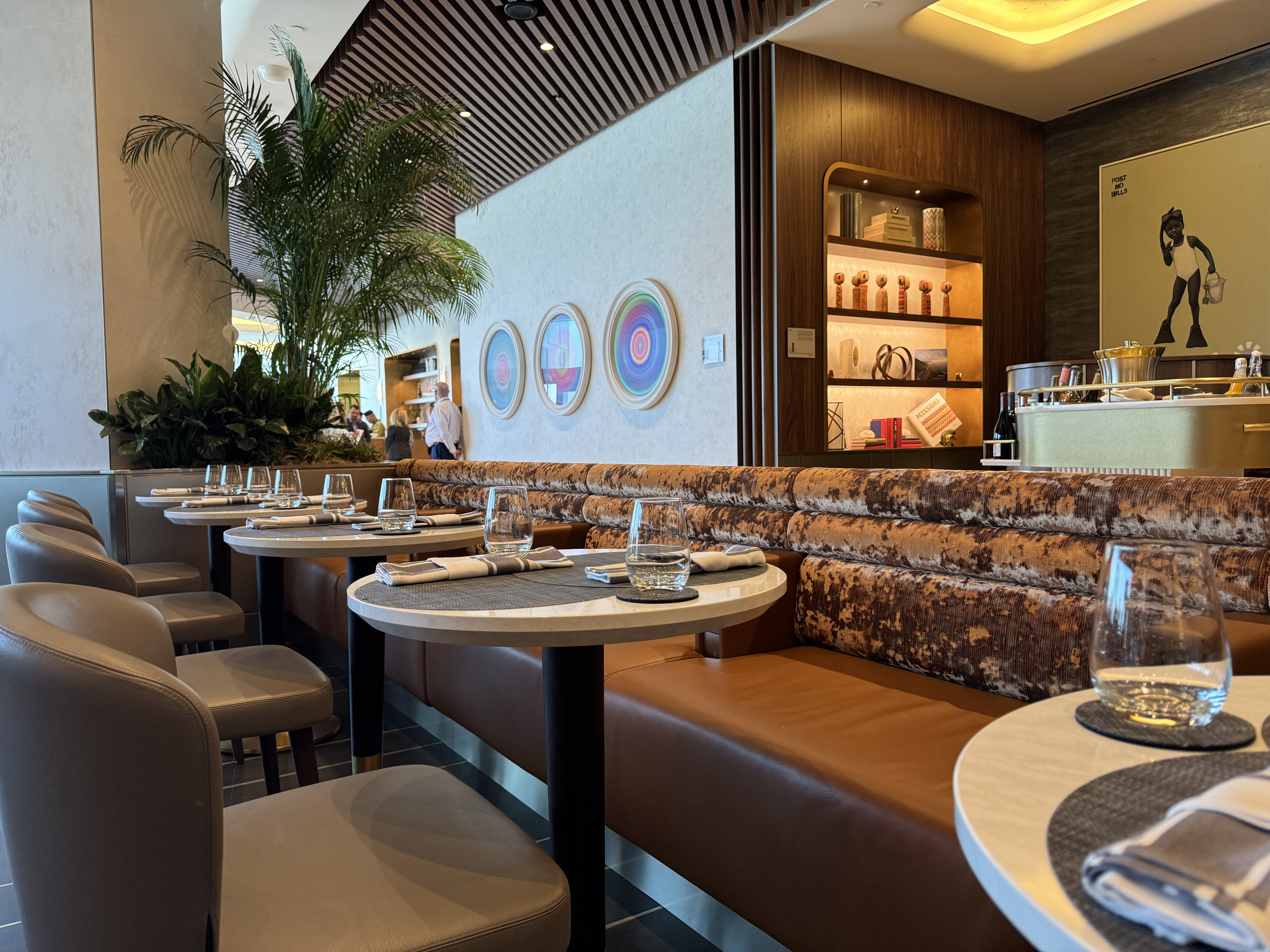 Delta One Lounge LAX Dining Room benches near bar Delta One Lounge LAX Dining Room benches near bar