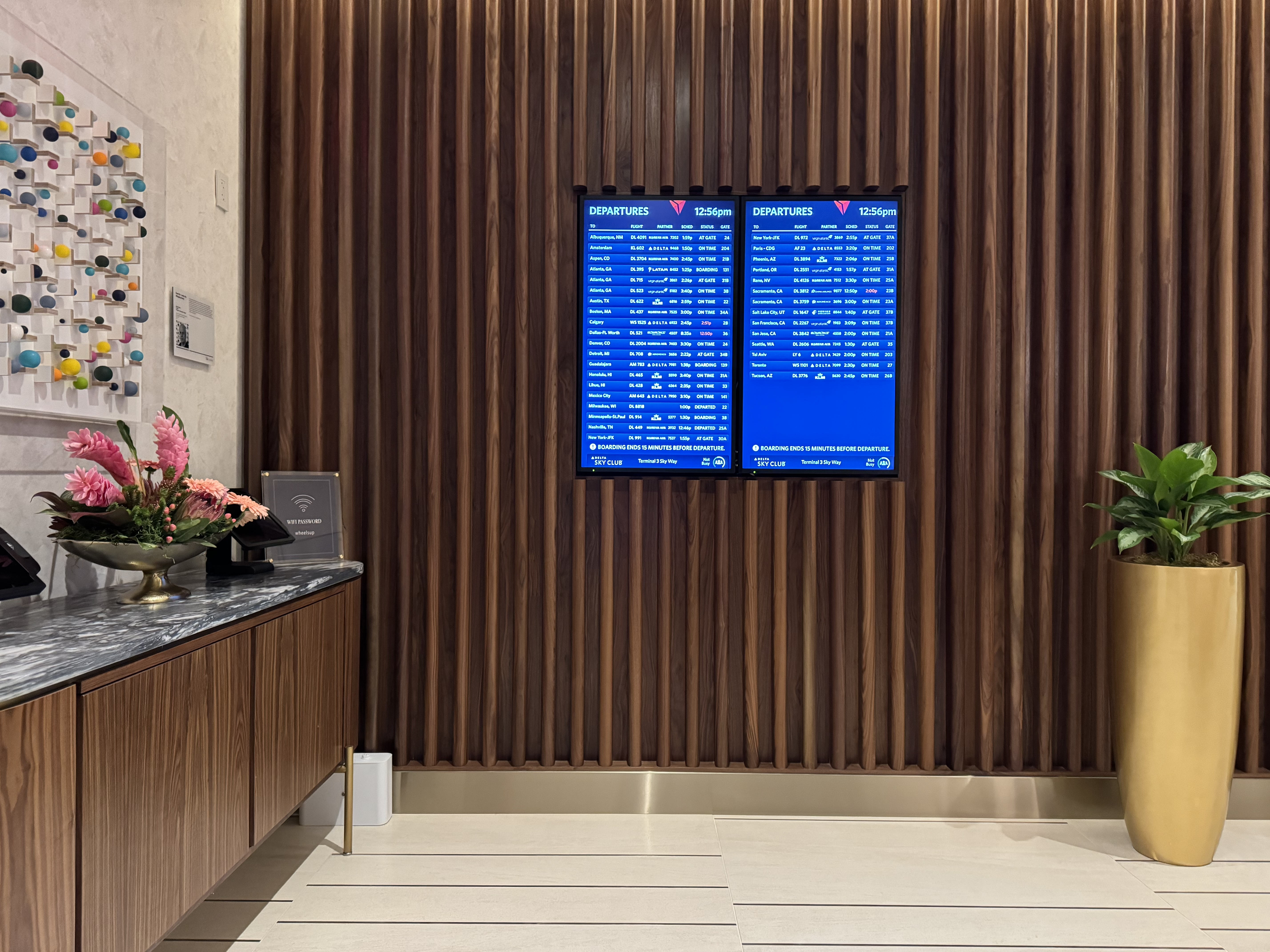 Delta One Lounge LAX departures boards at entrance Delta One Lounge LAX departures boards at entrance