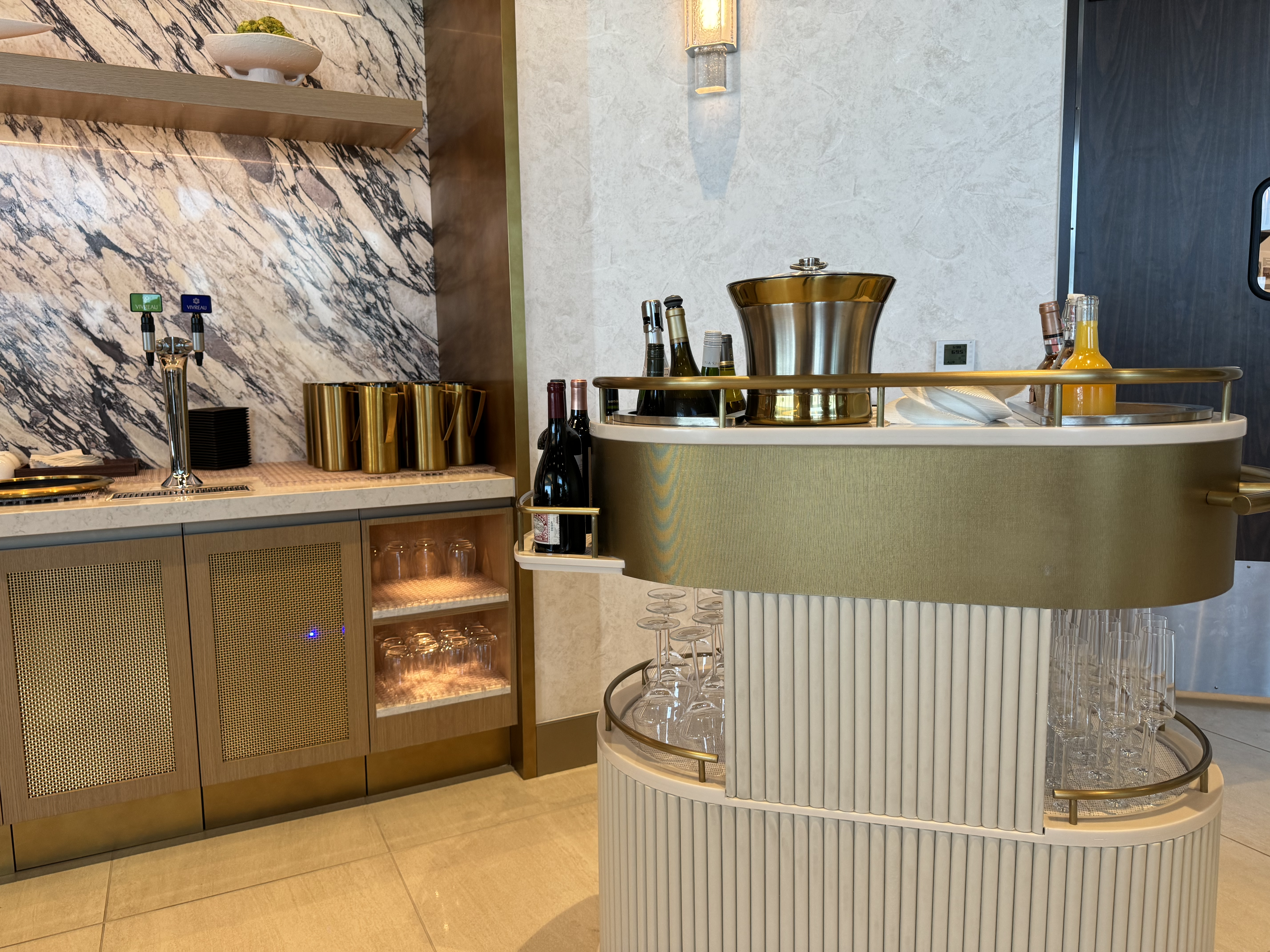 Delta One Lounge LAX drink cart near dessert table Delta One Lounge LAX drink cart near dessert table