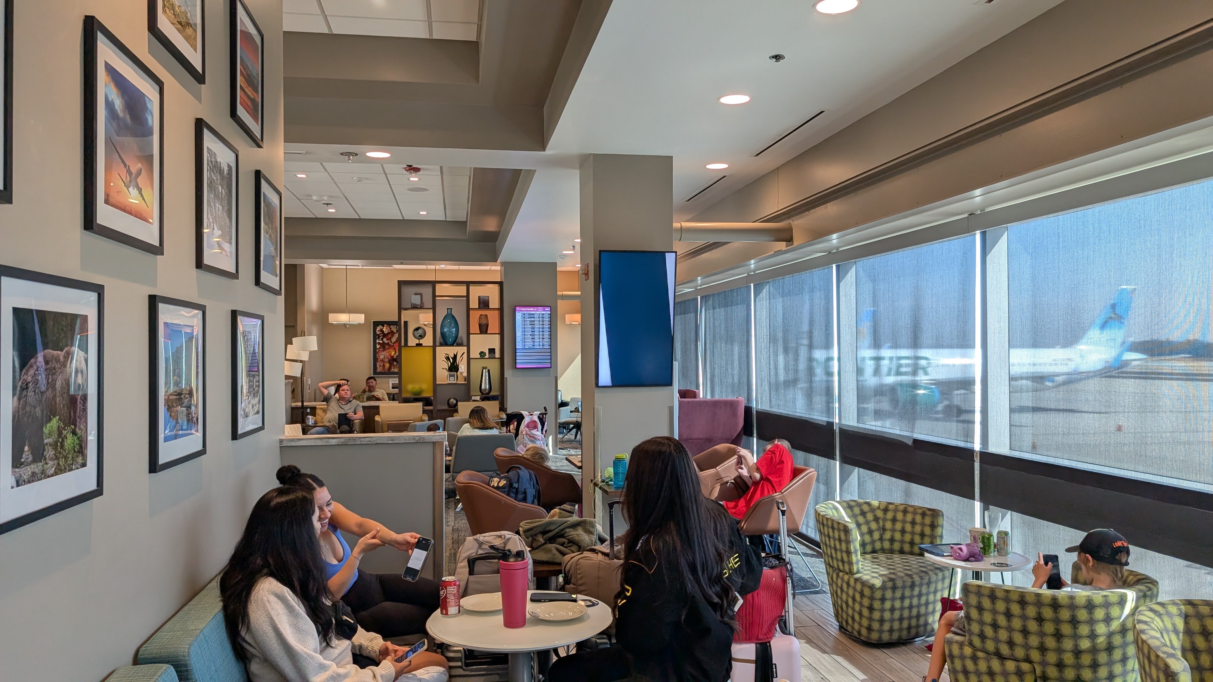 ONT Terminal 2 Aspire Lounge seating with a window ONT Terminal 2 Aspire Lounge seating with a window