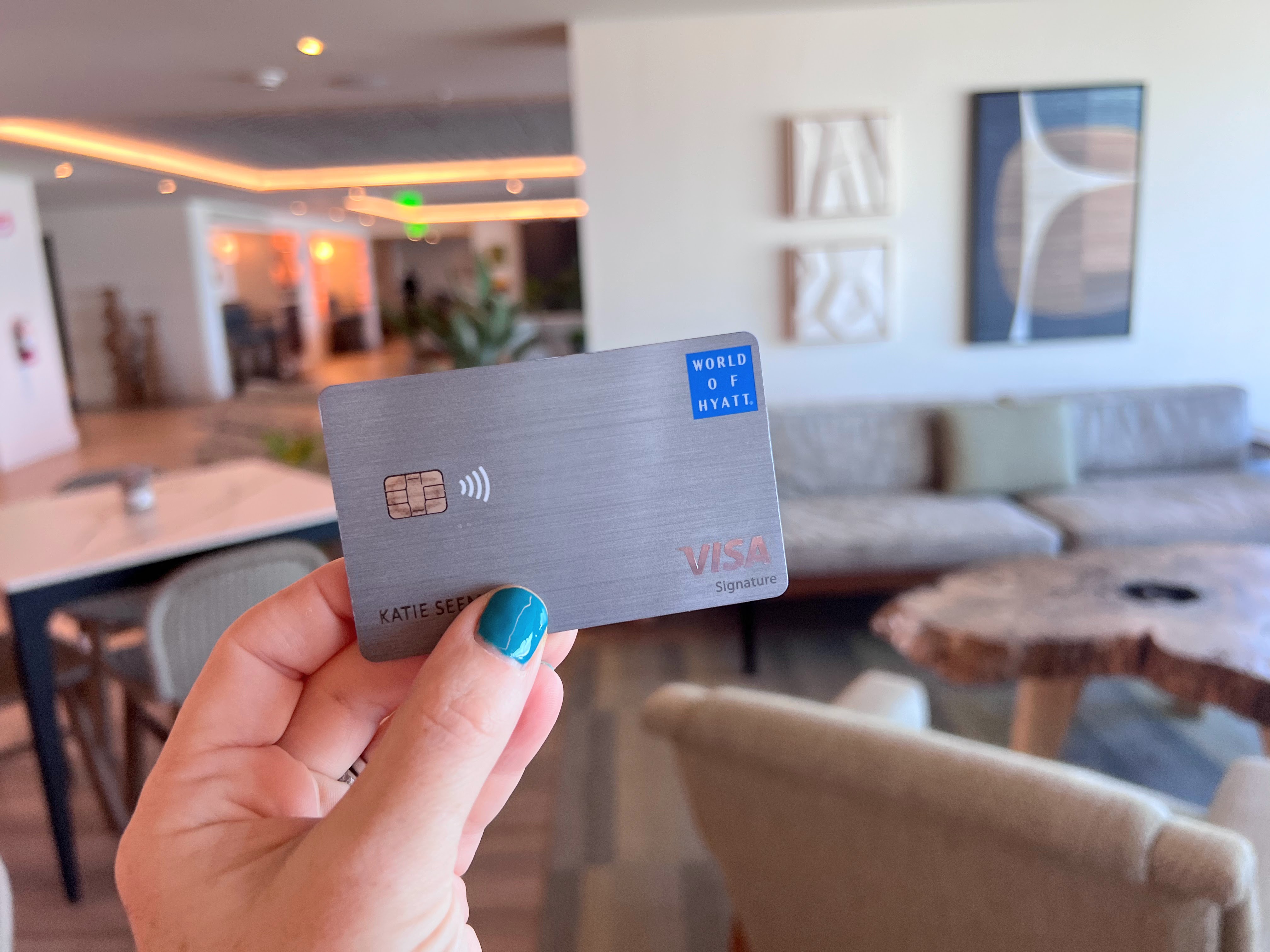 World of Hyatt credit card in a hotel lobby