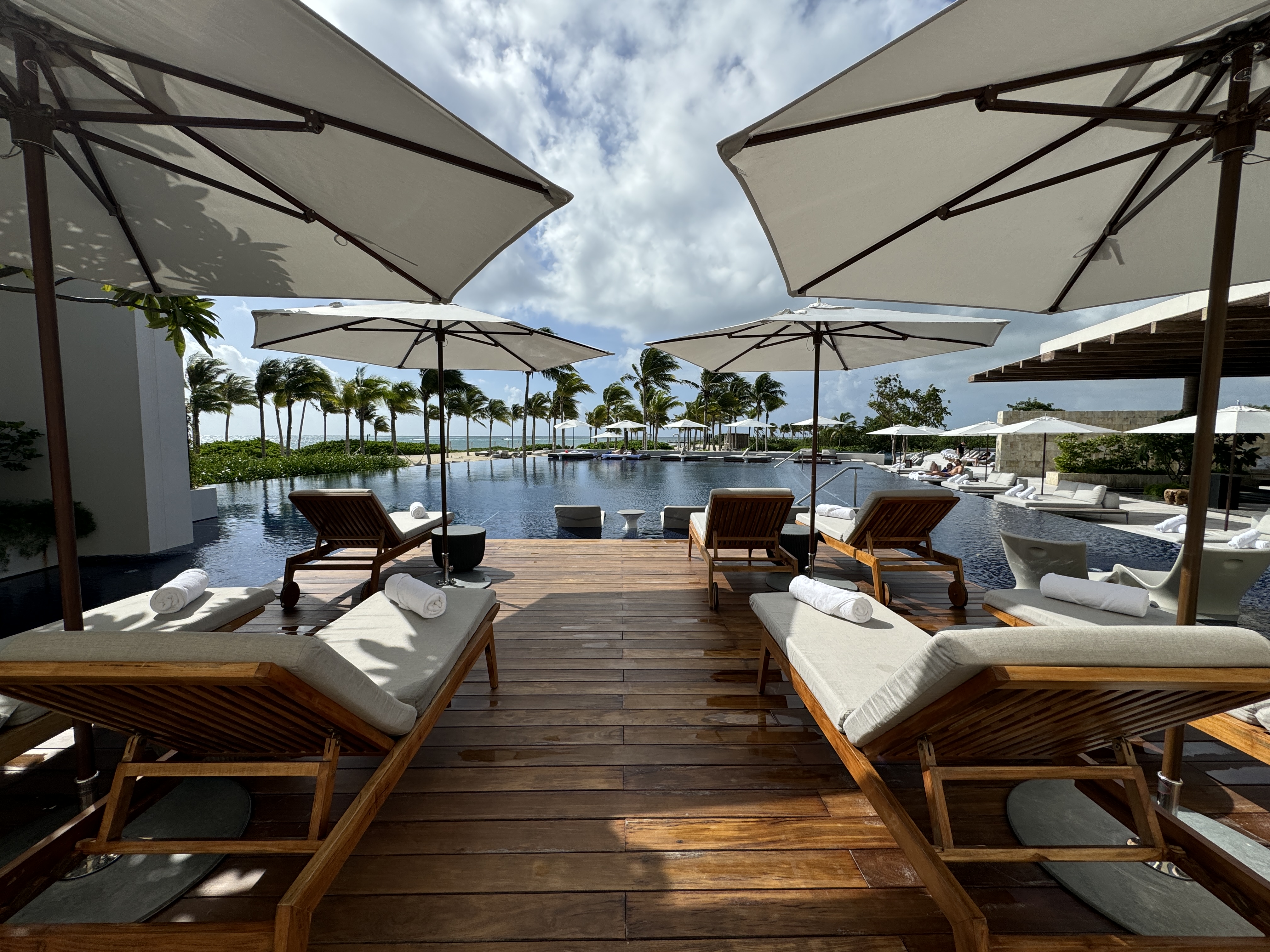 St. Regis Kanai pool loungers and umbrellas St. Regis Kanai pool loungers and umbrellas