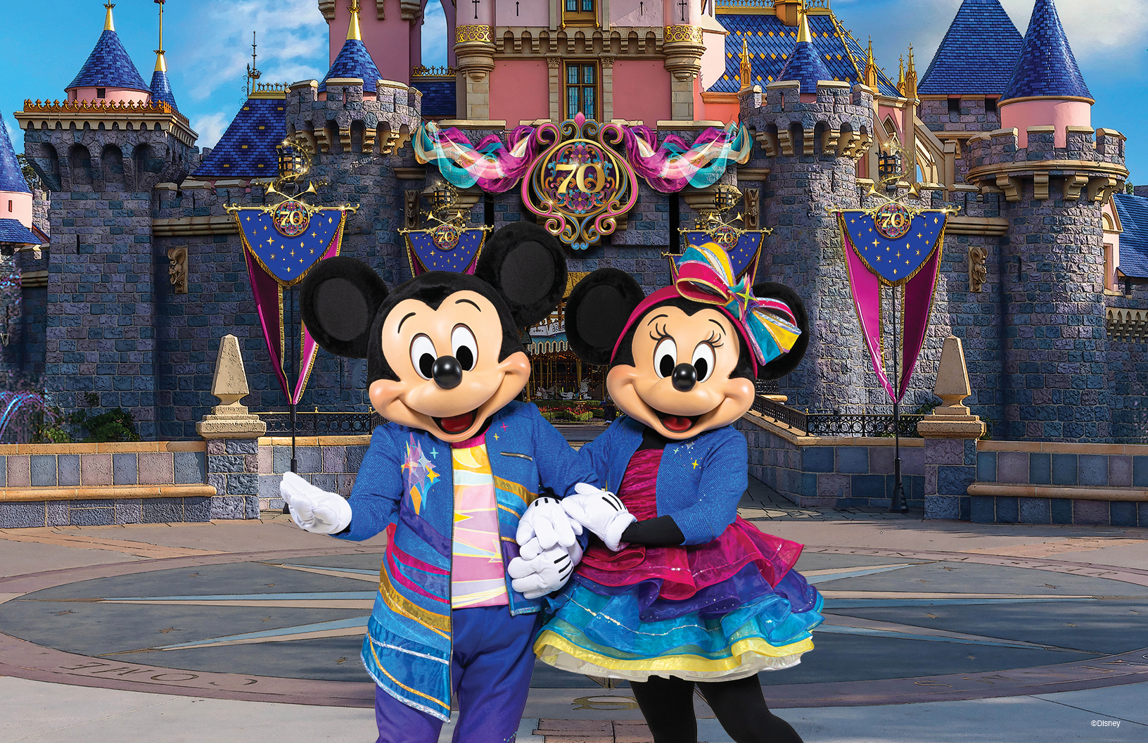 DLR 2025 Event Dates Details 1 1 Mickey and Minnie in front of a castle with 70th anniversary decorations