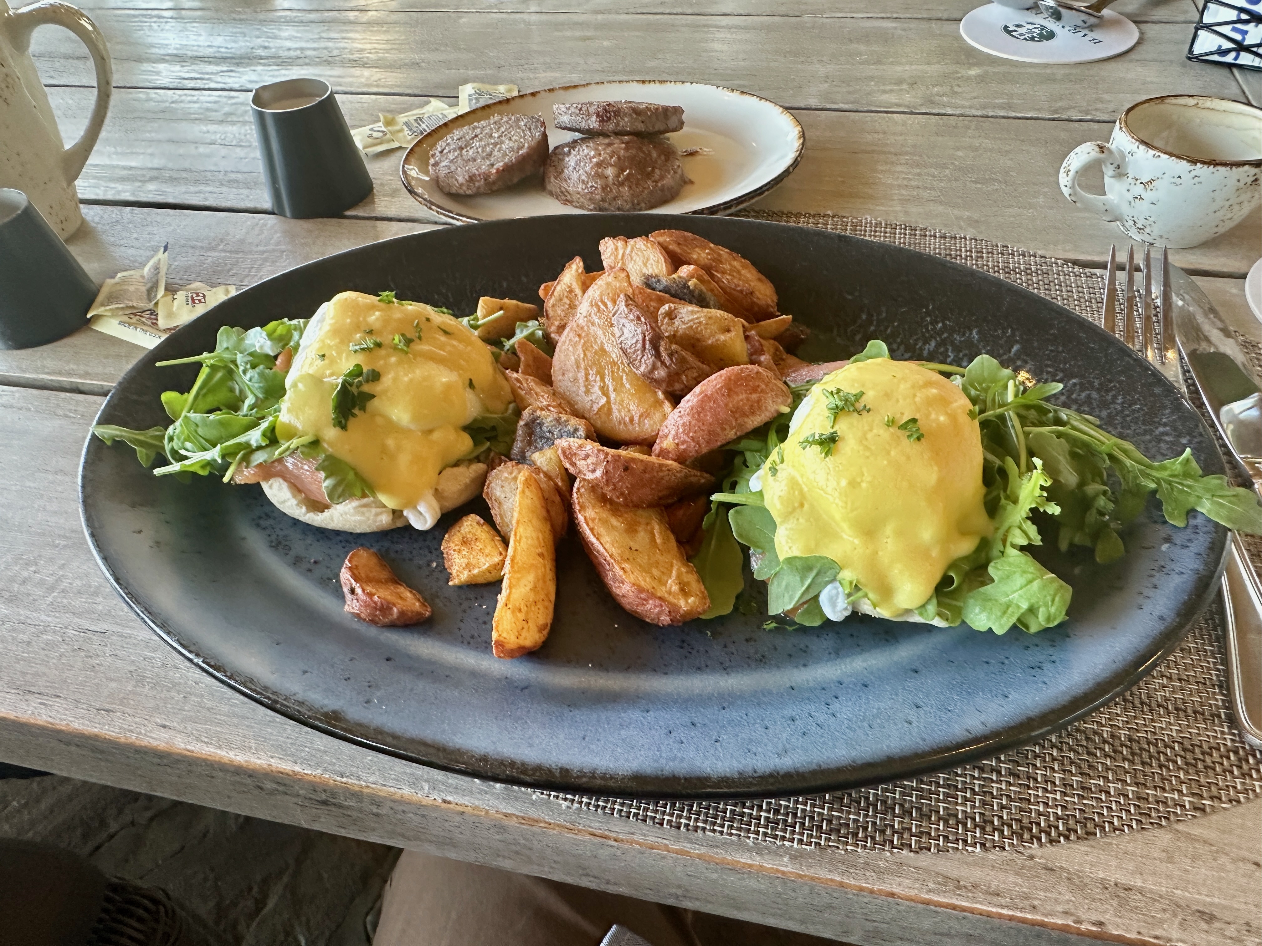 A plate with eggs benedict on a table