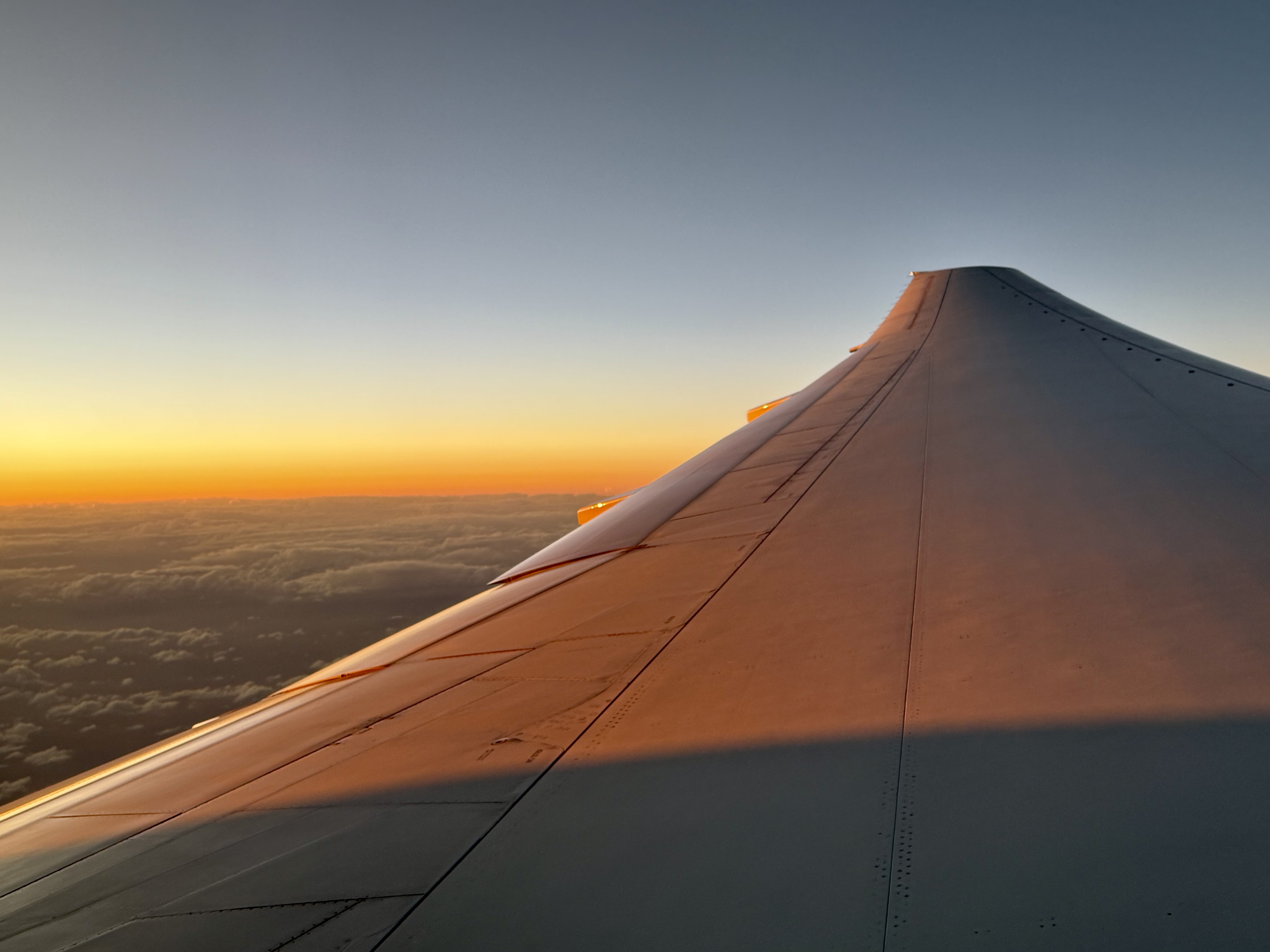 American Airlines Boeing 777 wing sunset American Airlines Boeing 777 wing sunset