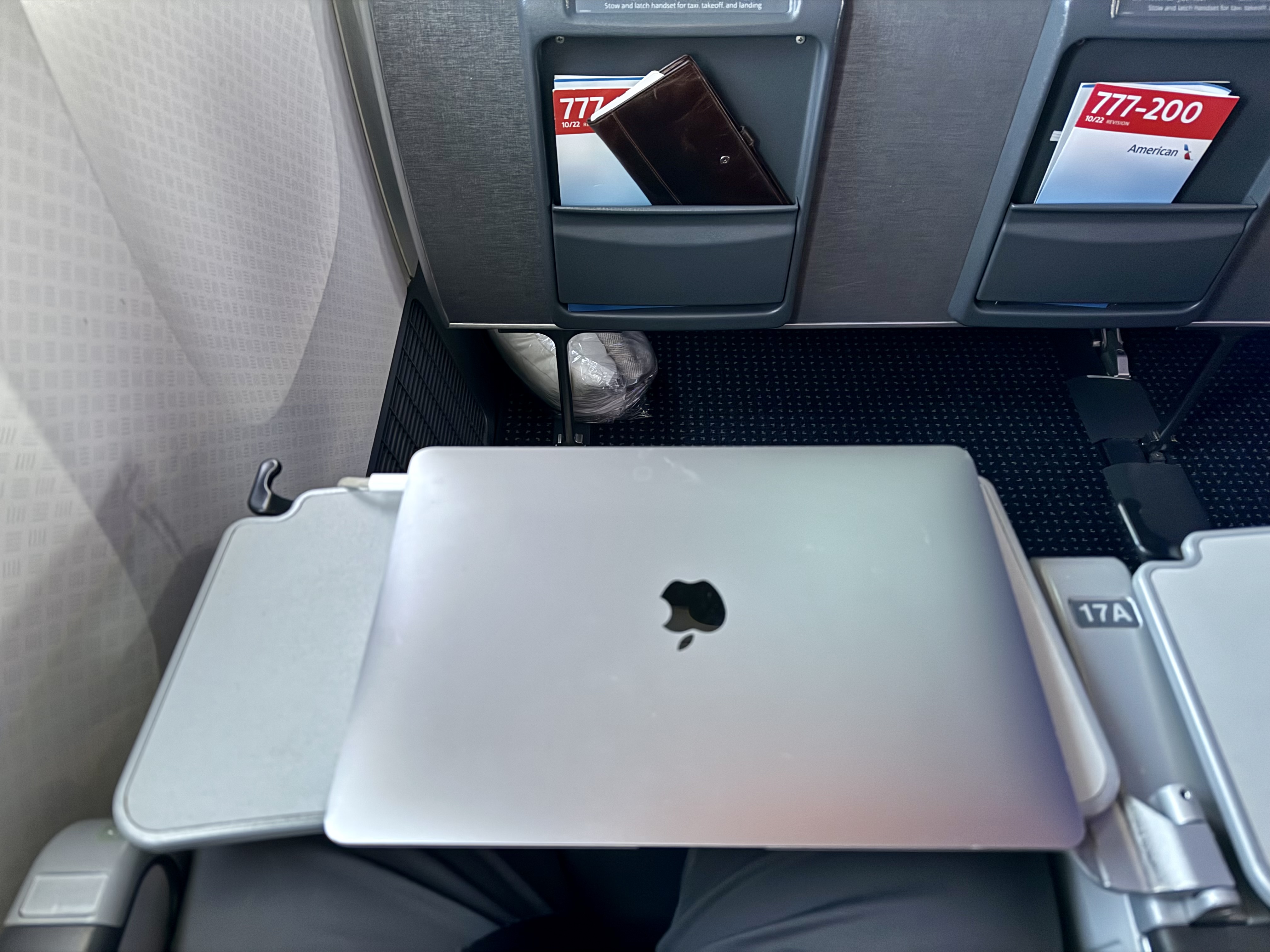 American Airlines economy laptop on tray table American Airlines economy laptop on tray table
