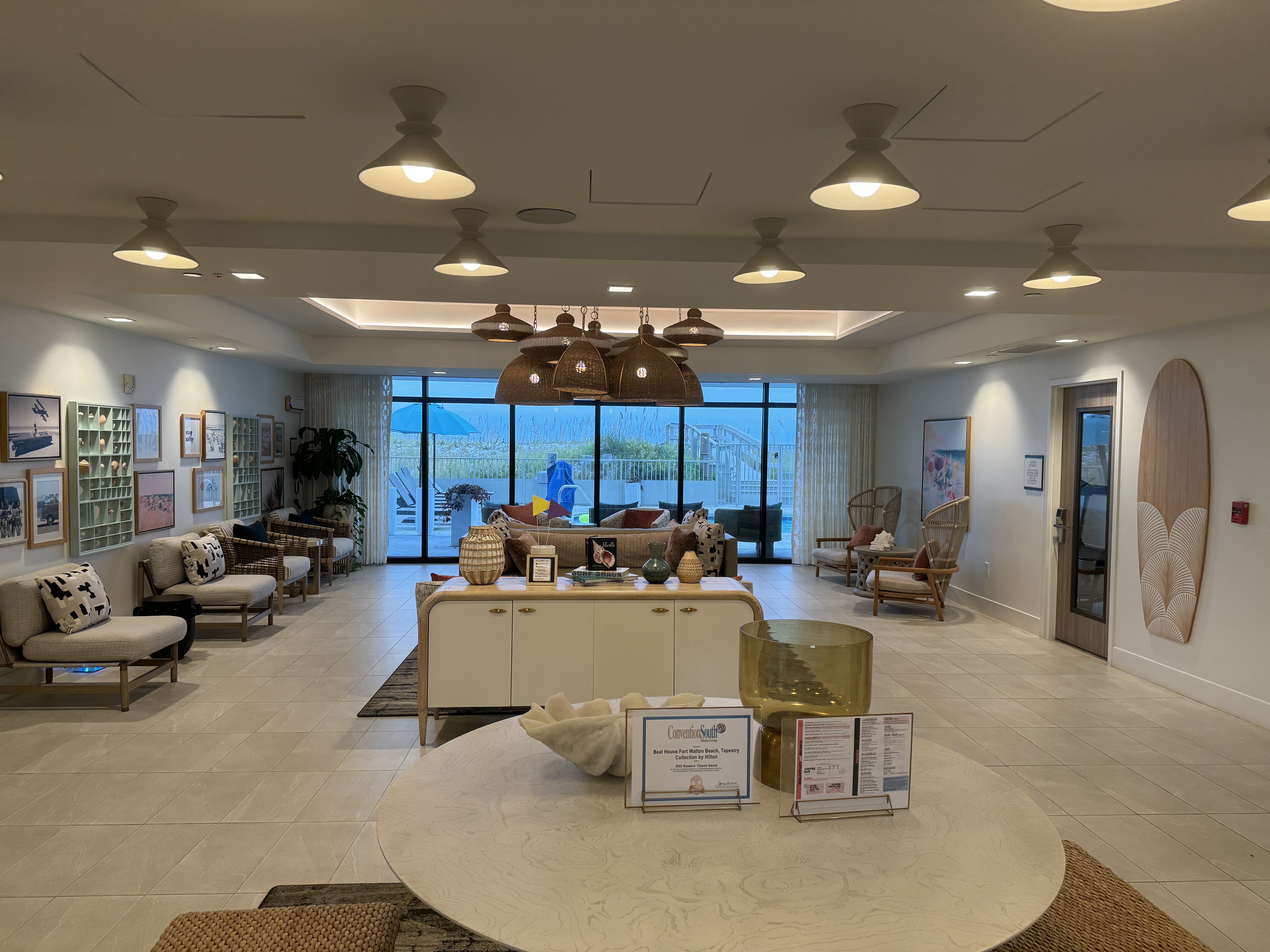 Beal House Fort Walton Beachfront, Tapestry Collection by Hilton entryway and seating.