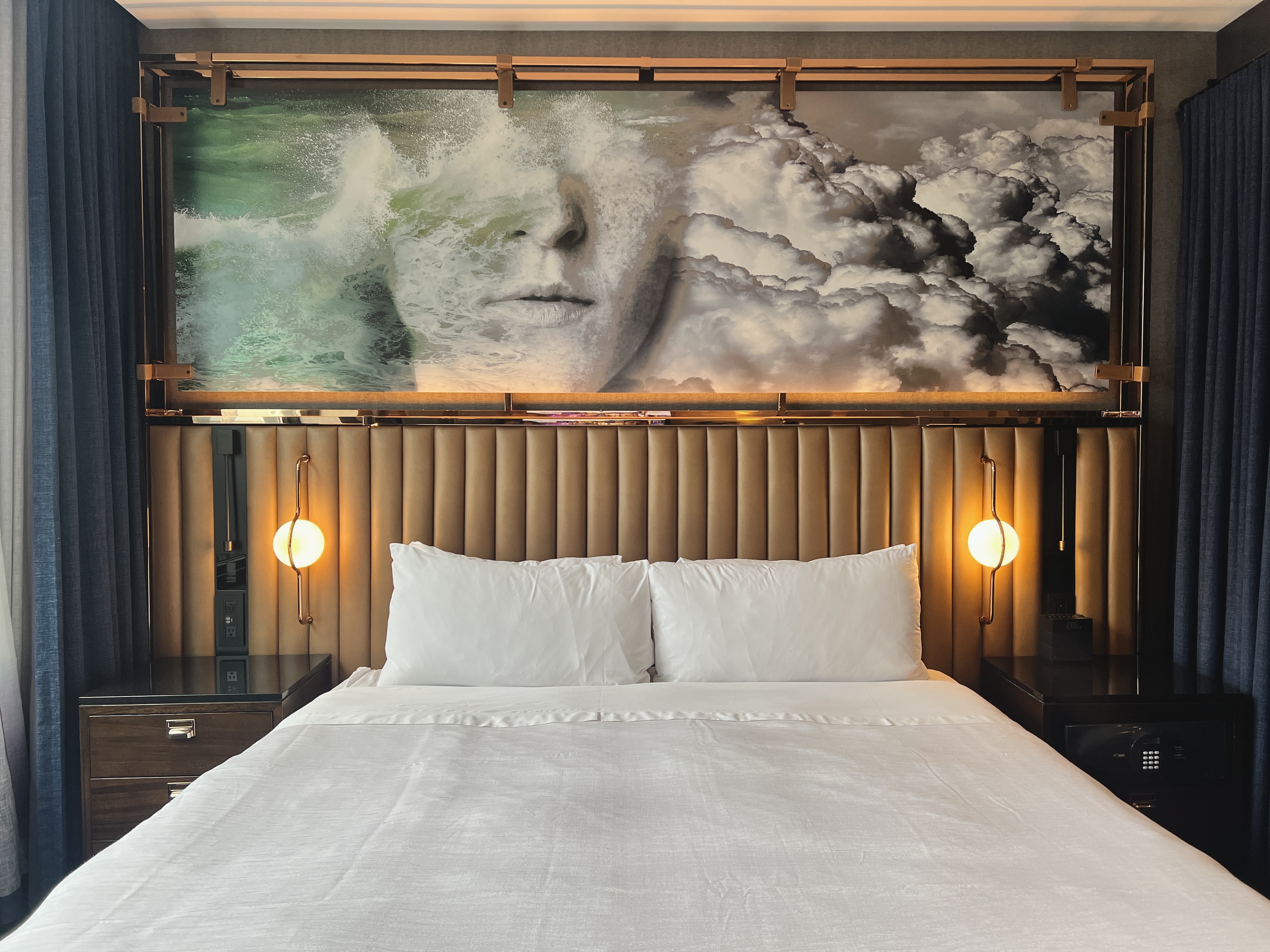 Hotel EMC2 Autograph Collection room bed headboard and art Hotel EMC2 Autograph Collection room bed headboard and art