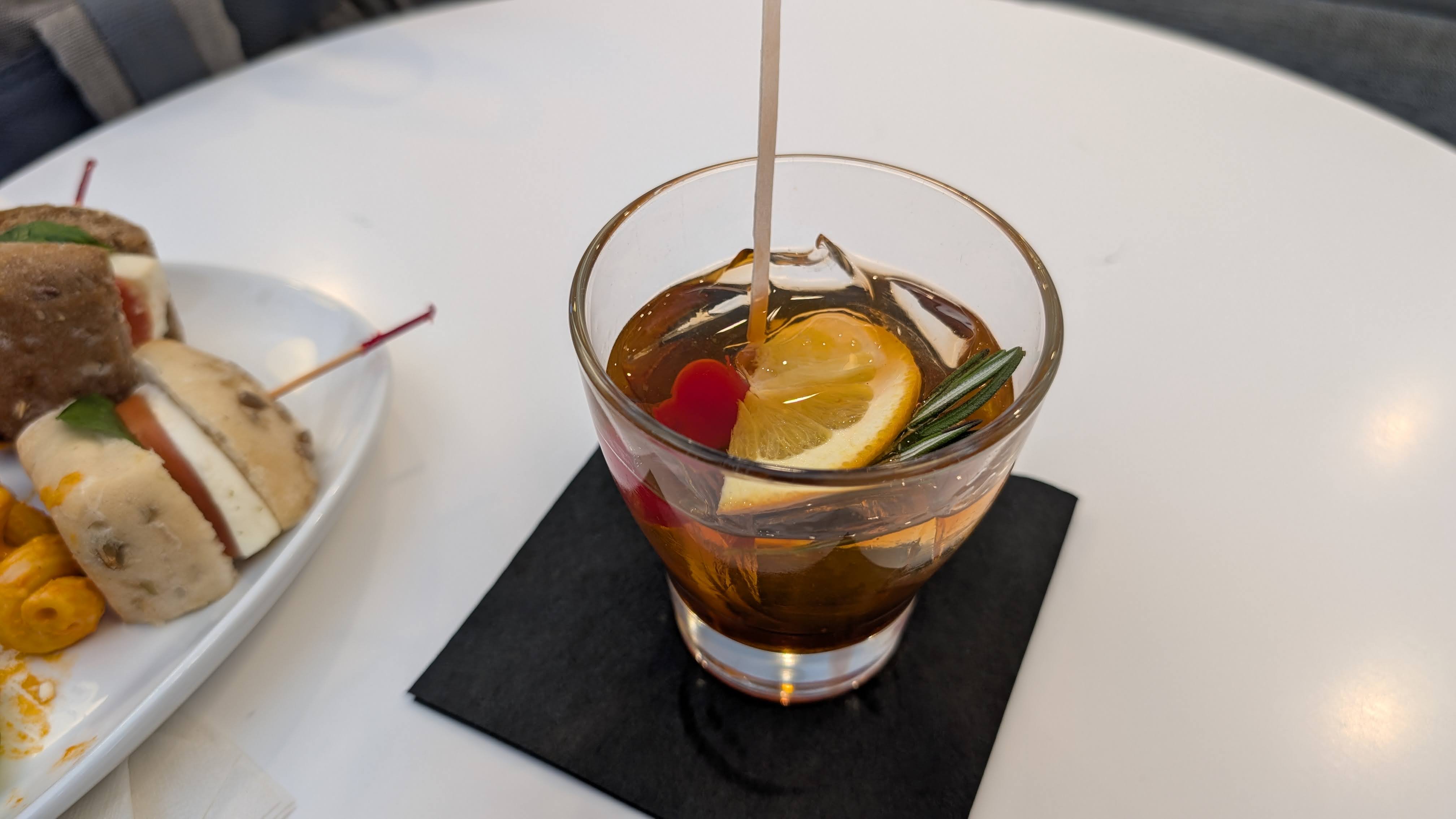 The Club MCO Terminal A food and beverage bar specialty drink old fashioned The Club MCO Terminal A food and beverage bar specialty drink old fashioned