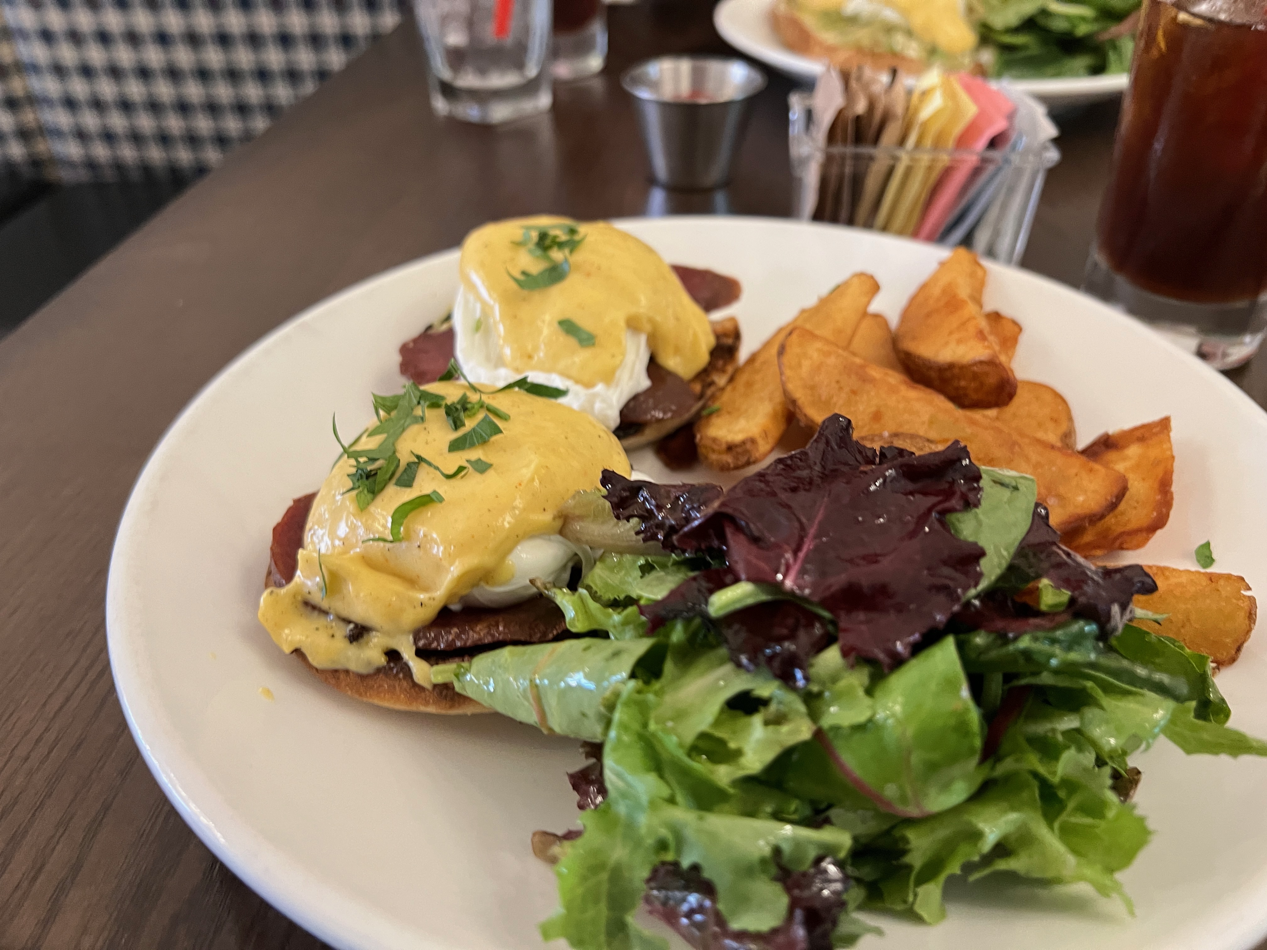 Eggs benedict on a white plate Eggs benedict on a white plate