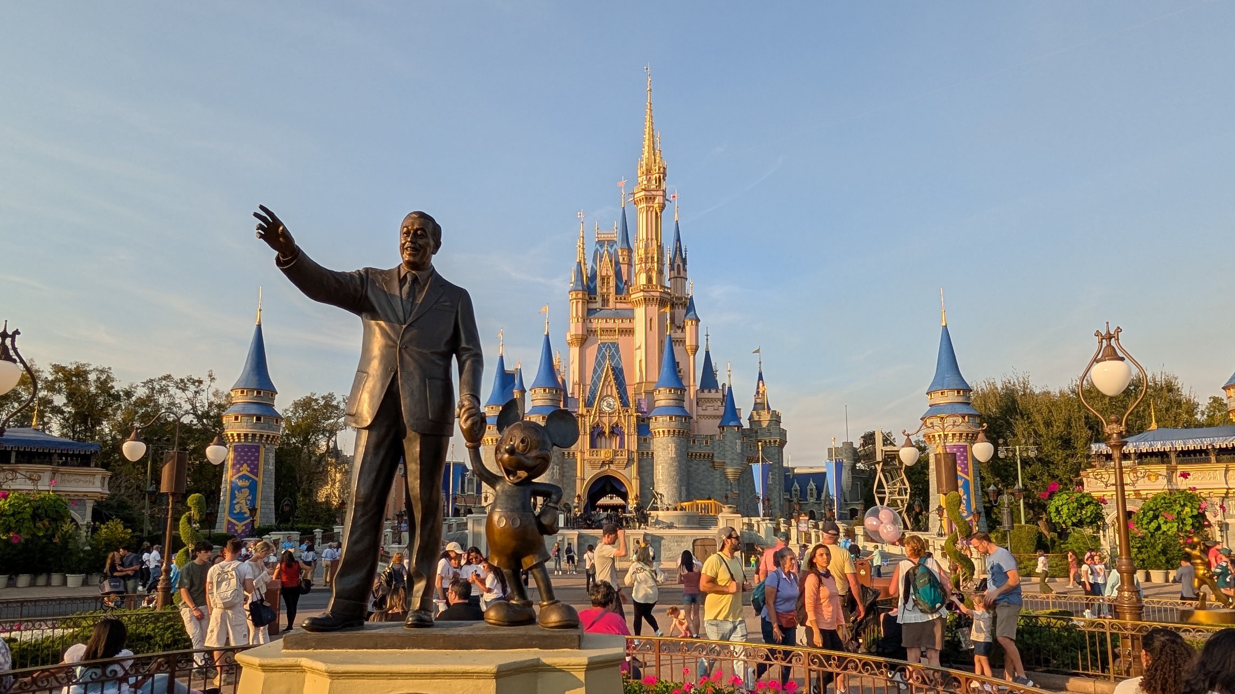 Walt Disney World Magic Kingdom Cinderella’s Castle with Walt Disney and Mickey statue Walt Disney World Magic Kingdom Cinderella's Castle with Walt Disney and Mickey statue